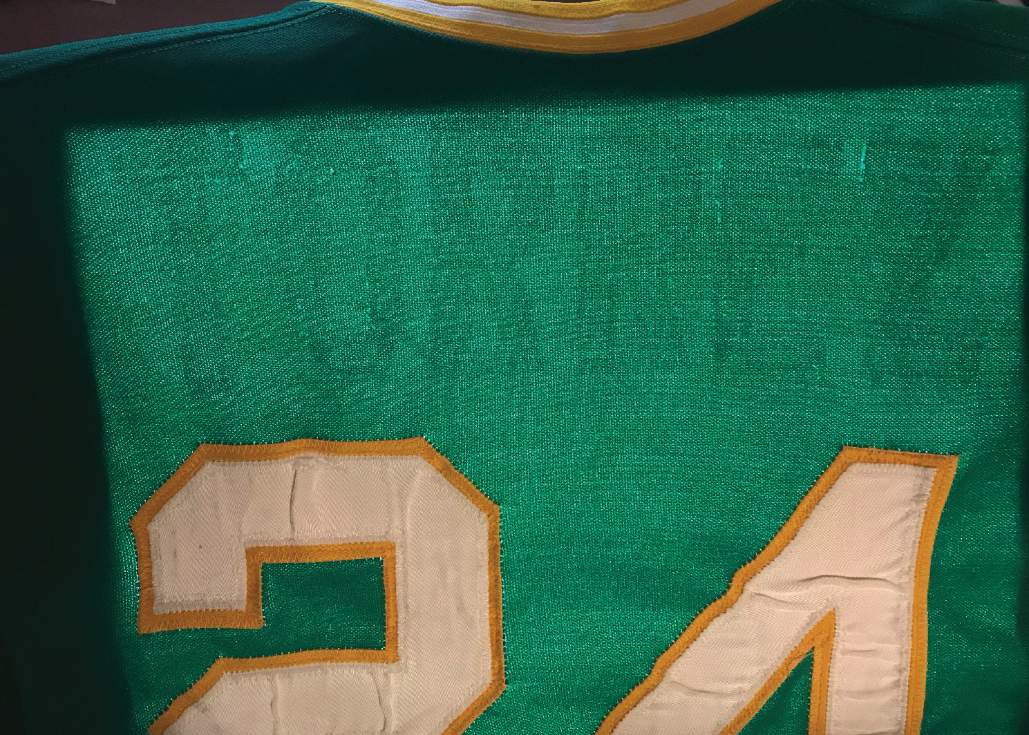 The "ghost" of the name on the back (NOB) is visible on the light table.