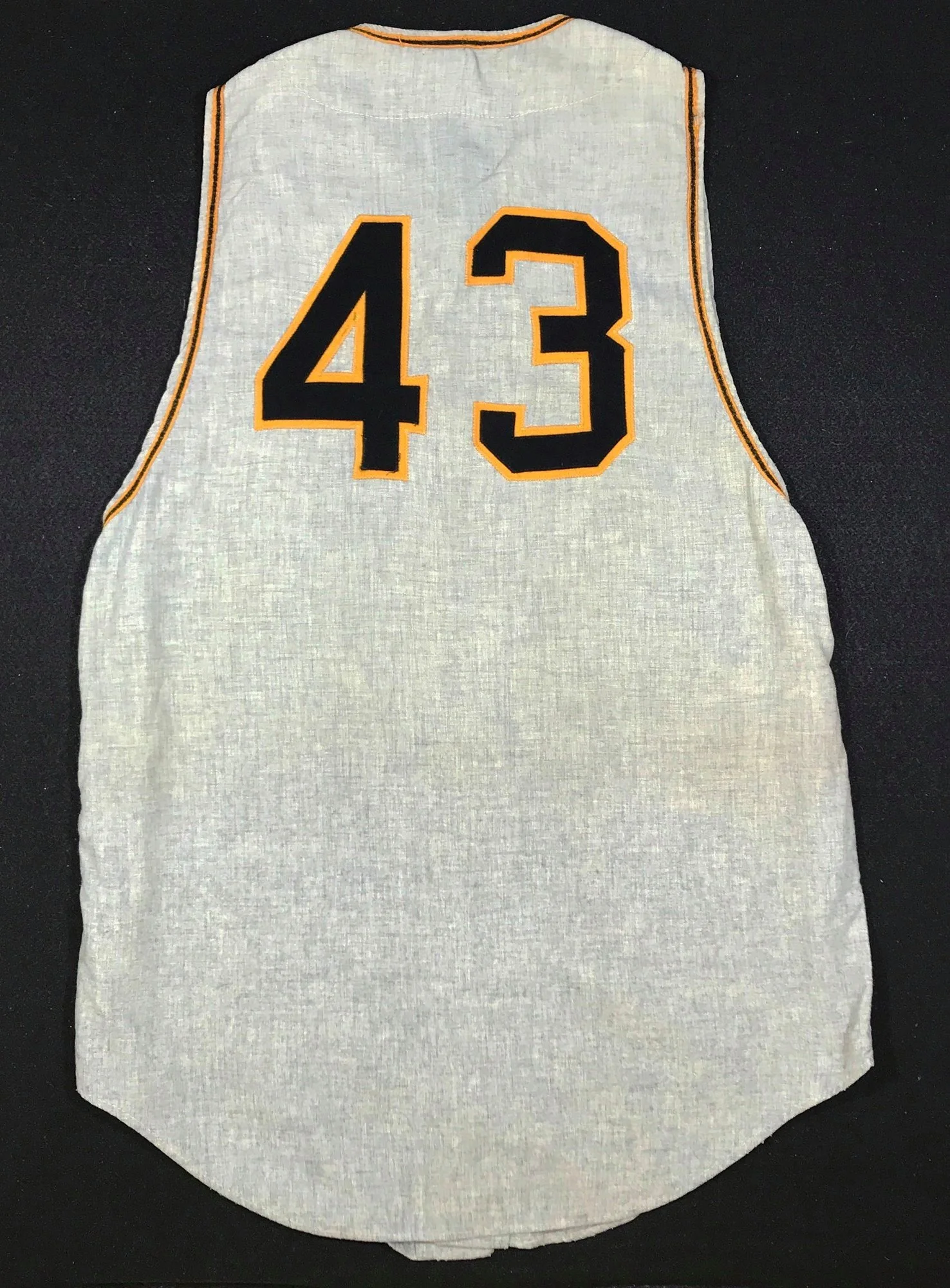 The answer is found in an idea that is unthinkable for most collectors. Our customer procured another 1960 Pirates jersey, that one having belonged to a coach, and asked me to “harvest”: the trim from it and swap it onto the Clemente. Gulp.