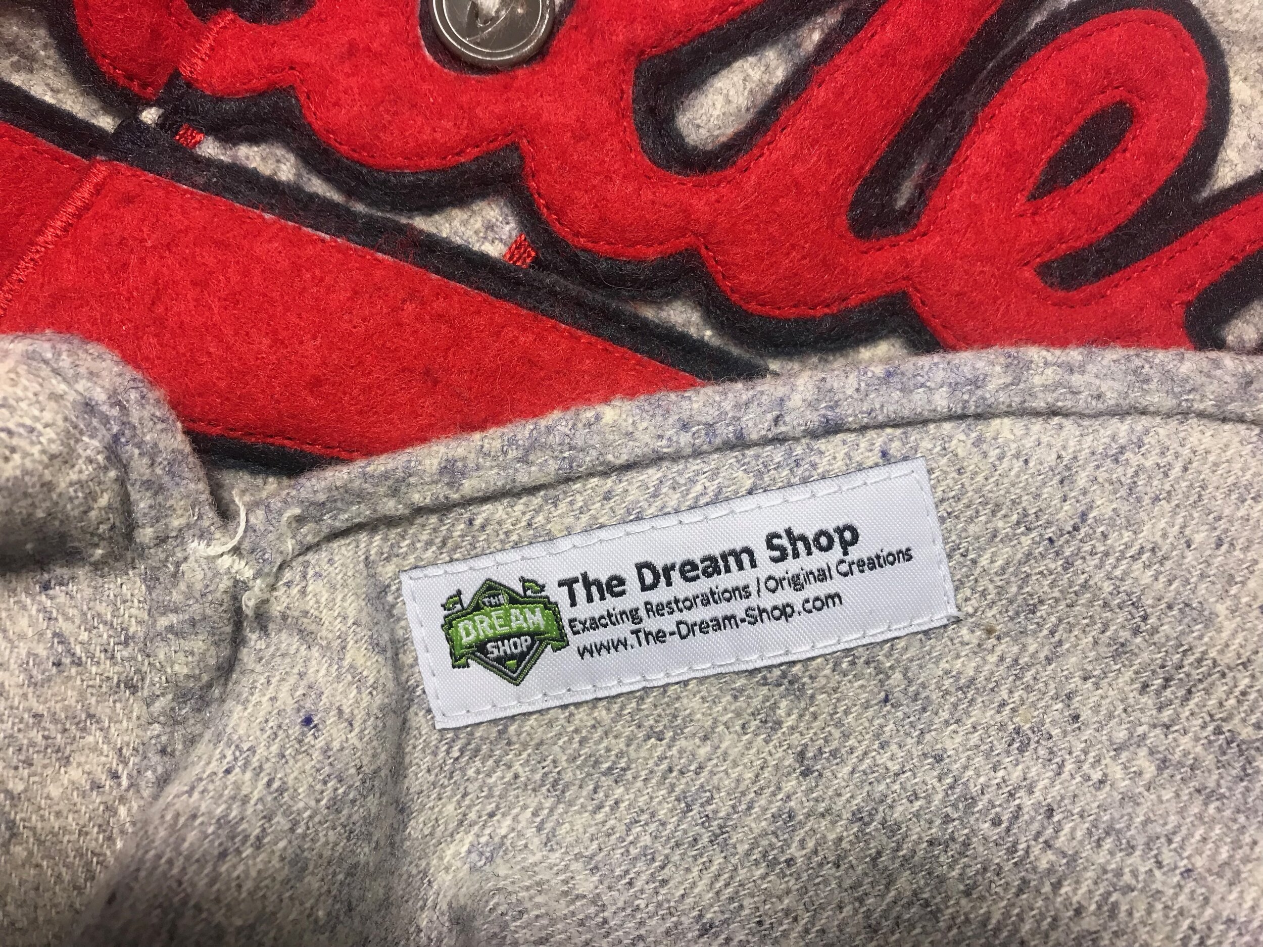 I sew the Shop's tag on all recreations. It would be too tempting for someone to someday try to pass this off as an original, game-worn jersey. 