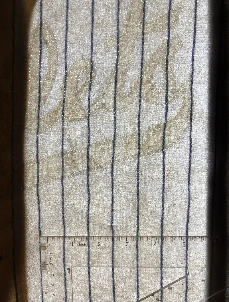 (shown here on the light table but without any photo enhancement) So why is the Triplets shadow so prominent? The reason is primarily because the fabric beneath it is thicker than the surrounding fabric. As this jersey was washed dozens of times with