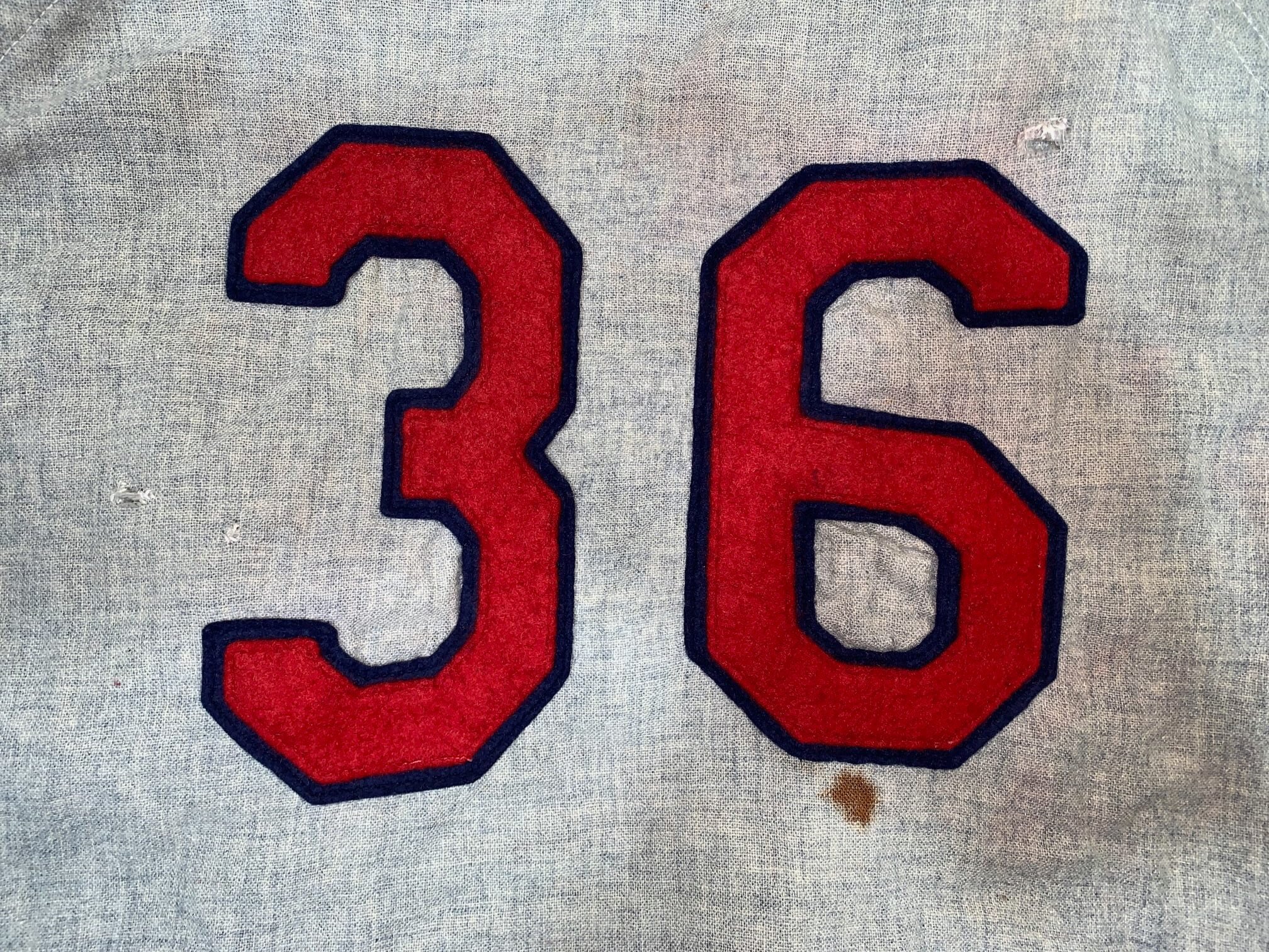 Closely examining the back of the jersey, I noted a couple of things: the mismatched #36 on the back was a signature minor-league modification, and the two back numerals were of different sizes. I put the jersey on the light table, and it could see a