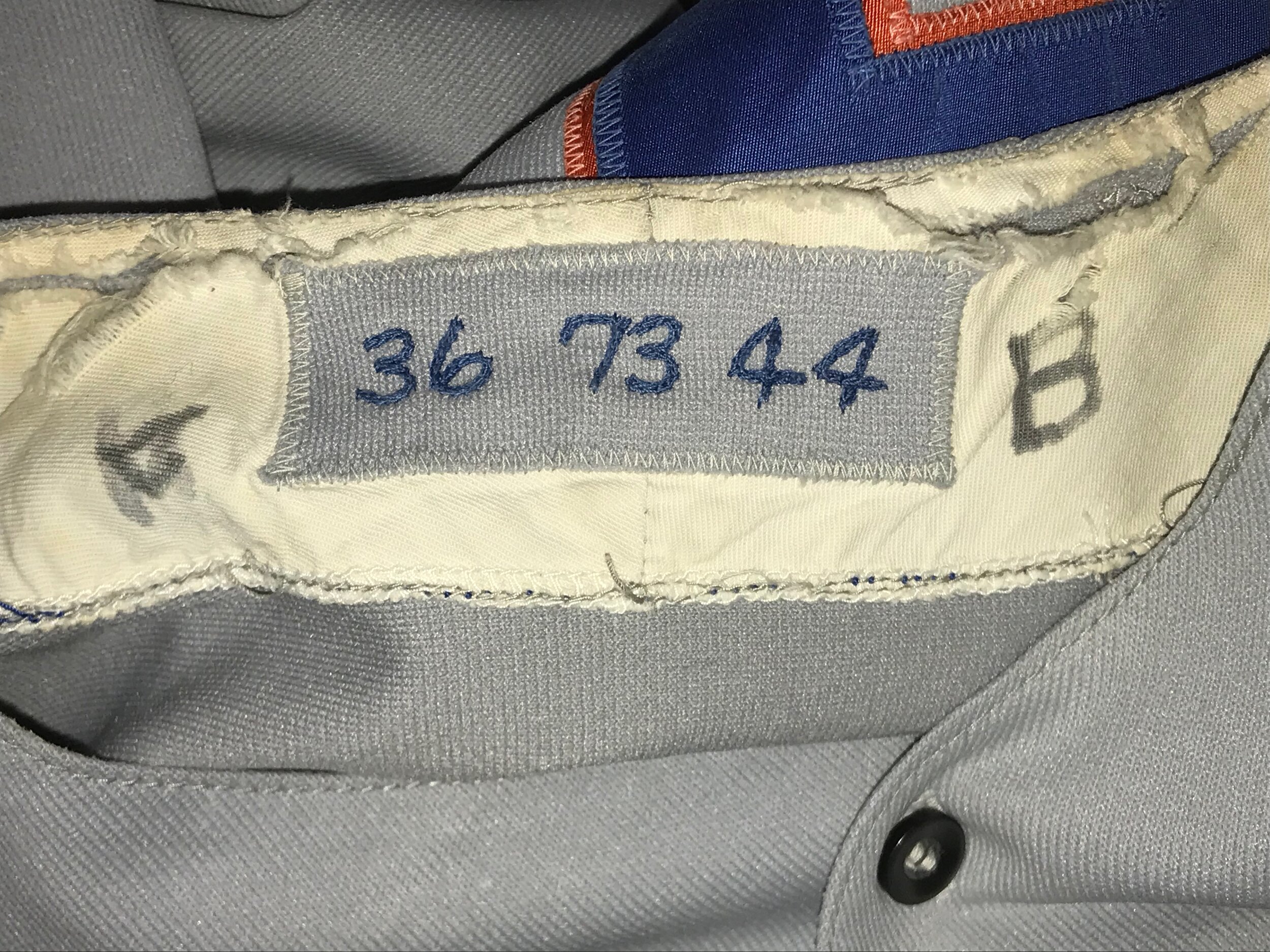The neck tag tells the story: player number 36, 1973 season, size 44. The magic marker scrawl on either side must have had some later, minor league significance.