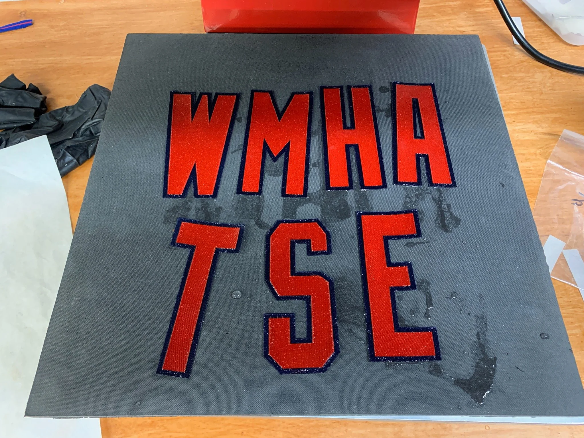 Then I steam it aggressively at 330 degrees, creating clouds of hissing vapor. The result of all this abuse creates lettering that closely matches the old in terms of texture, pucker, softness of edges, and color. (this is wet, "pre-steamed")