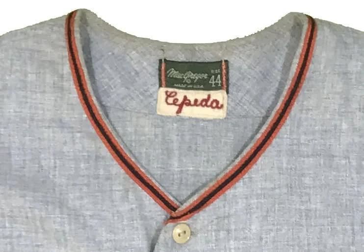 Along with the original back numbers, Cepeda’s name remains hand chain stitched in red embroidery thread on a small rectangle of felt, stitched into the back of the neck.