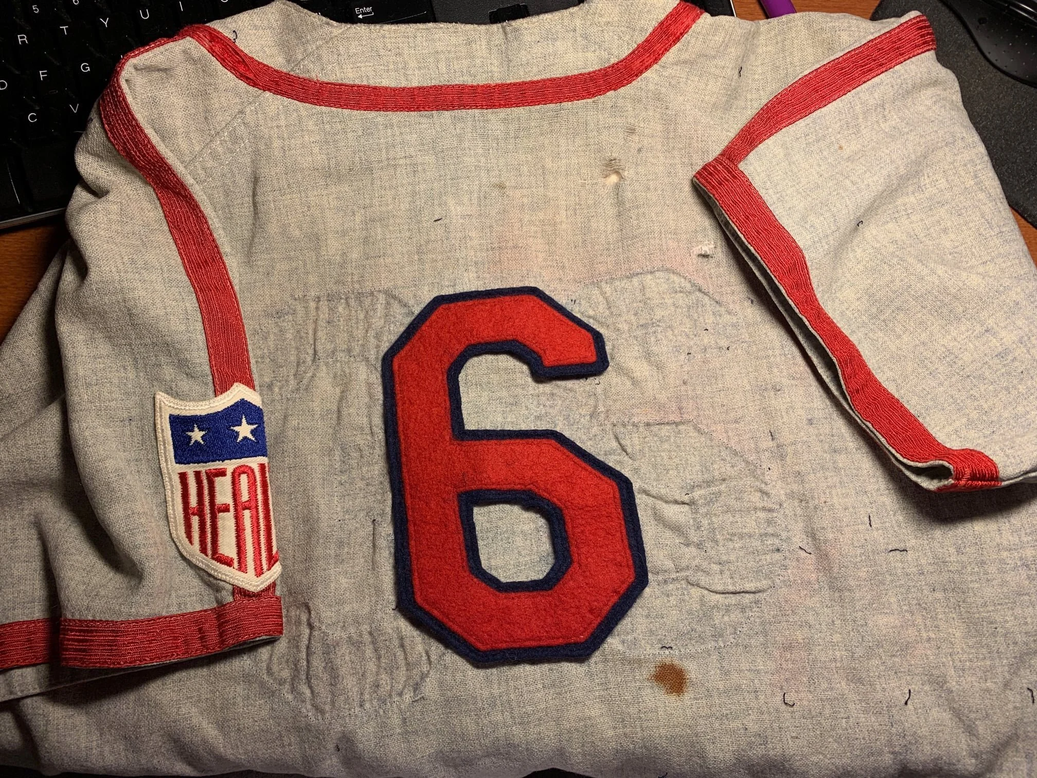 Dr. Kirsch was delighted with this news, and asked me if I would restore the number to the back. Even though the “6” we took off the shirt was not a perfect match to the MLB Cardinals’ 1942 font, it was antique and original to the Cards’ organization