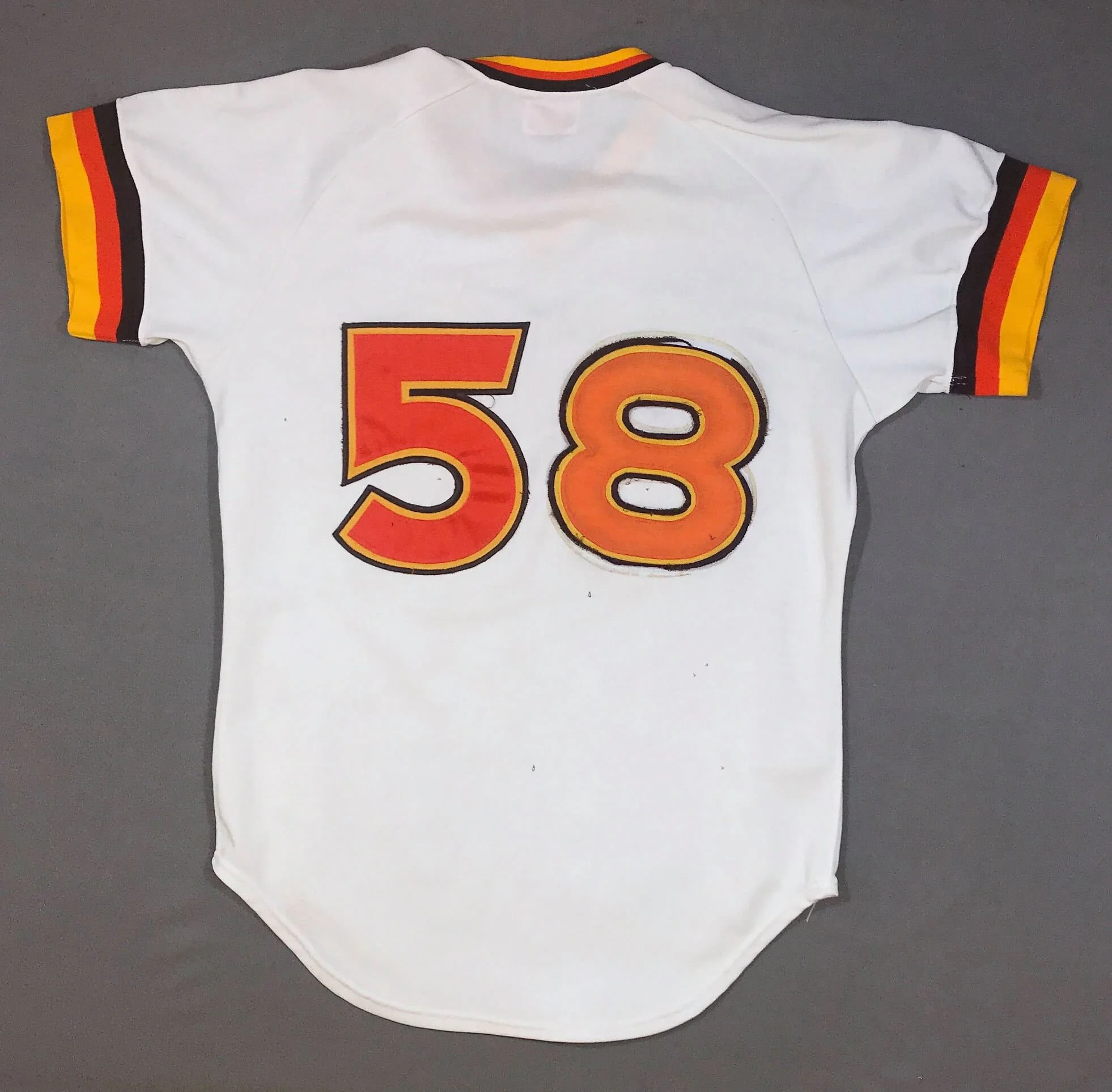 Kyle spotted this jersey on eBay. This is how it looked, as offered. When he saw it, he noticed the tail tag indicated the jersey had been issued originally as #53 -- he had a hunch, and figured if he was wrong, he could easily resell it again. His q