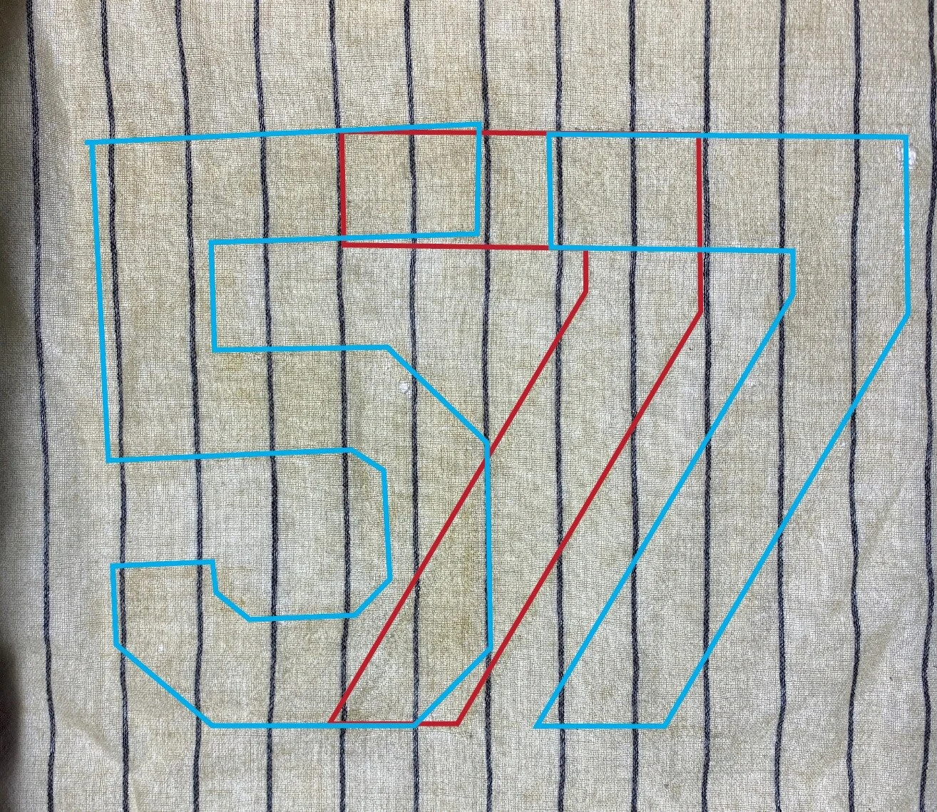 Light table investigation showed that there was once a “7” on the back, and also a “57”. But wait, would the team truly send a game jersey of one of the most famous players in history to the minors to be reissued? With the Yankees, the answer is “pos