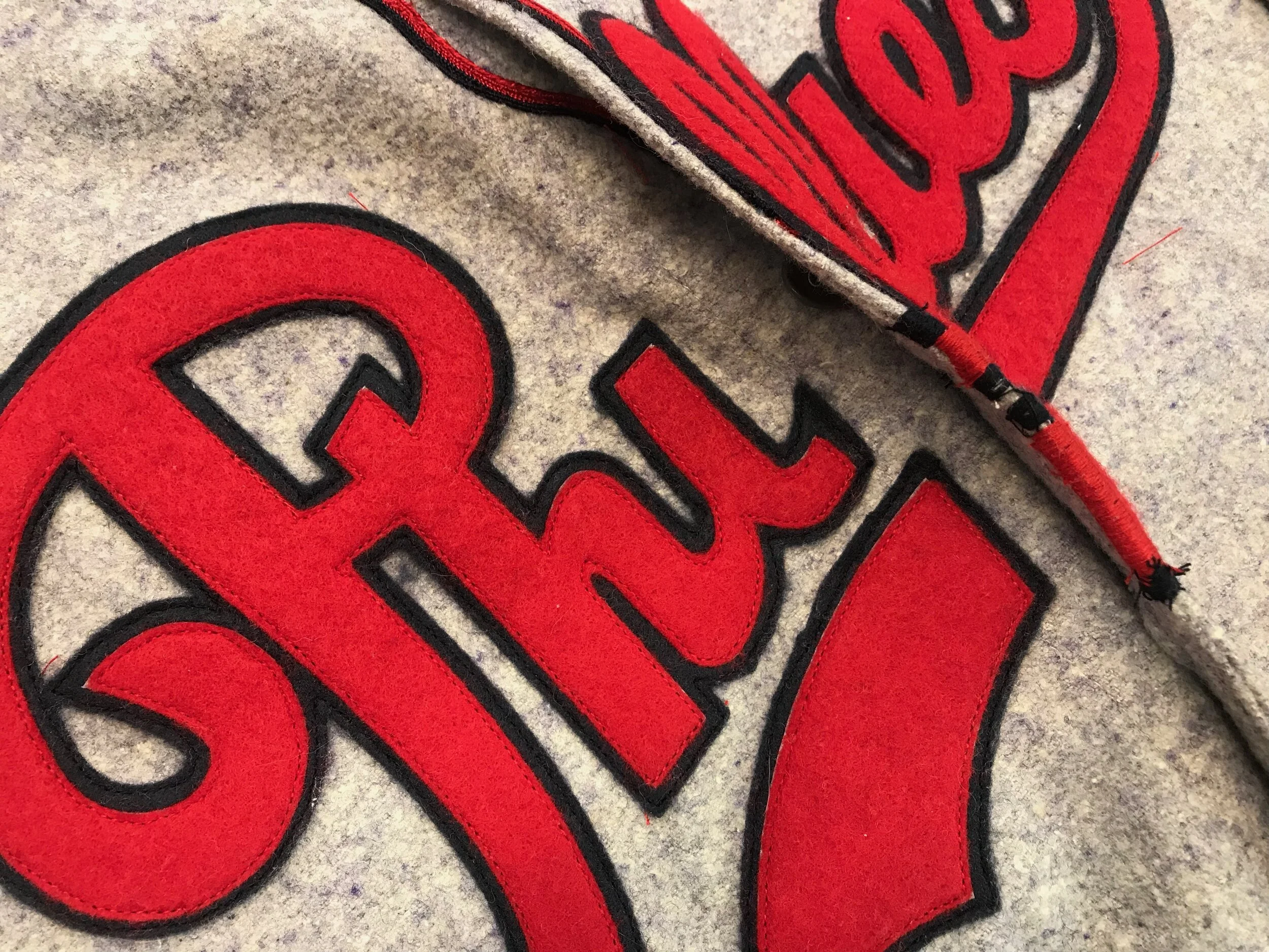 The overlapping edge receives a tight looped embroidery stitch to make it invisible when the jersey is buttoned. This is exactly the way these jerseys were made 80 years ago.