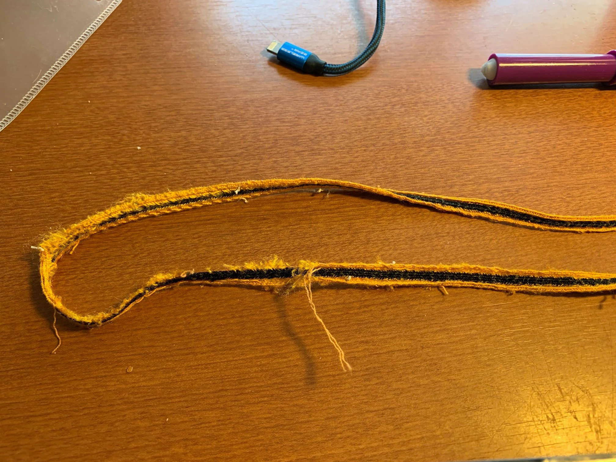 The trim needs to come off the coach’s jersey one painstaking stitch at a time. But it too has wear spots and is frayed, so that it is obvious we are not going to be able to swap the entire strips onto the Clemente. This is going to be even more tric