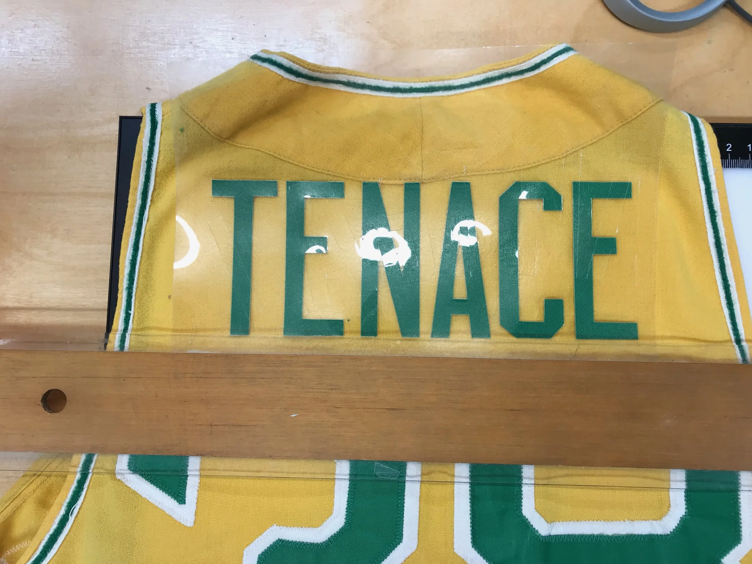 We laid out the name perfectly prior to heat-pressing it on for exact sewing.