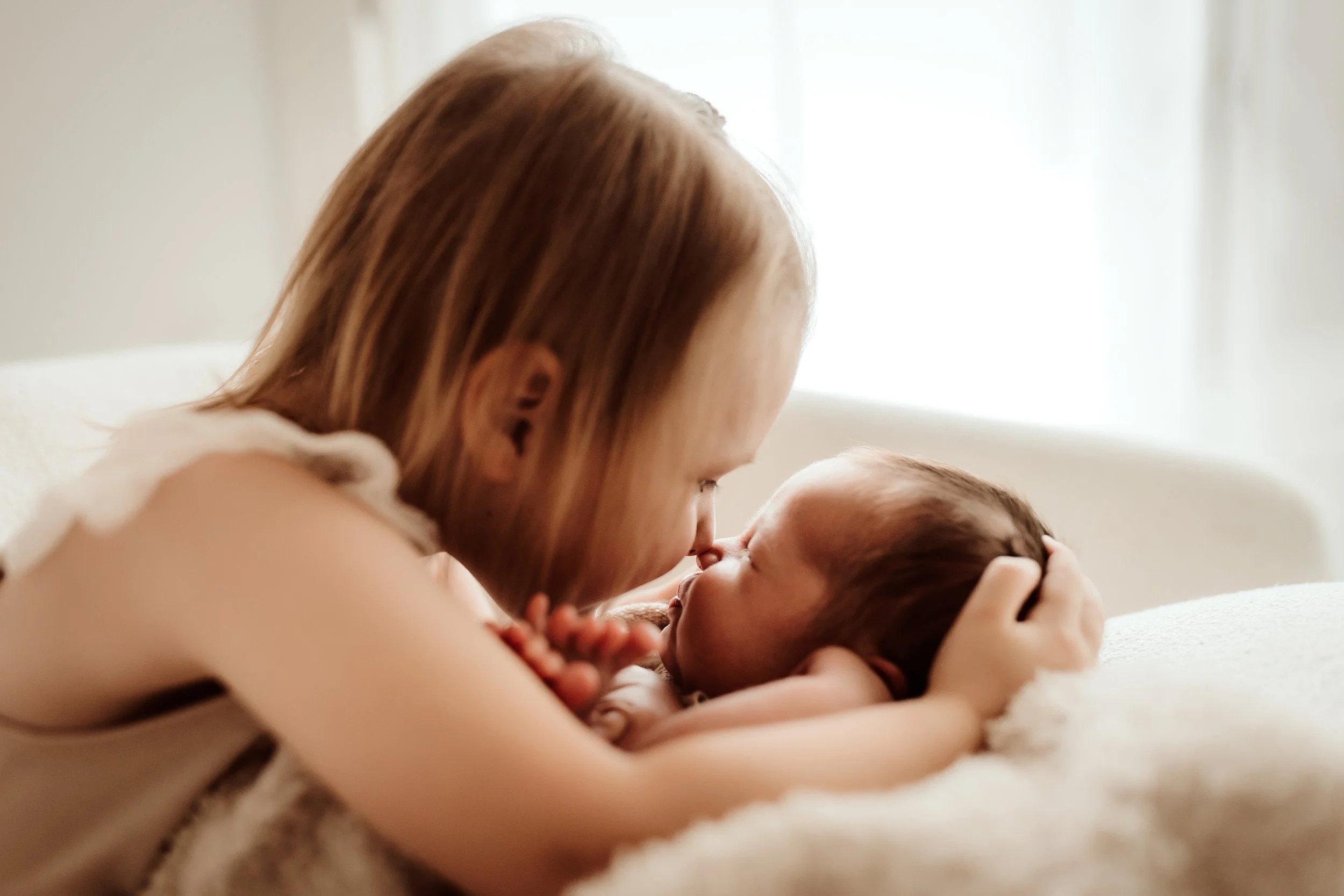 Beautiful photo of a newborn’s profile and tiny button nose