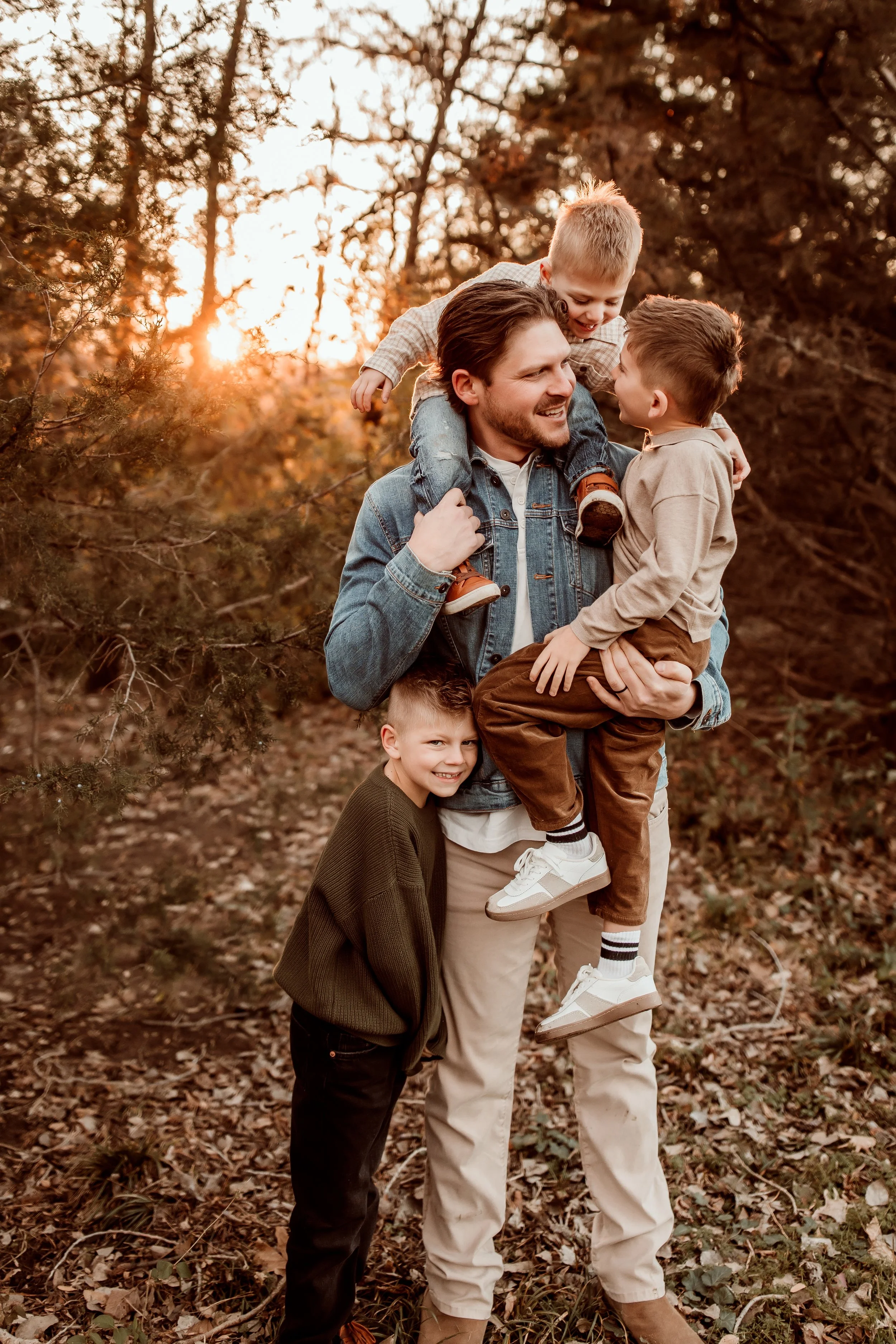 Family portraits at Sedgwick County Park during peak fall foliage