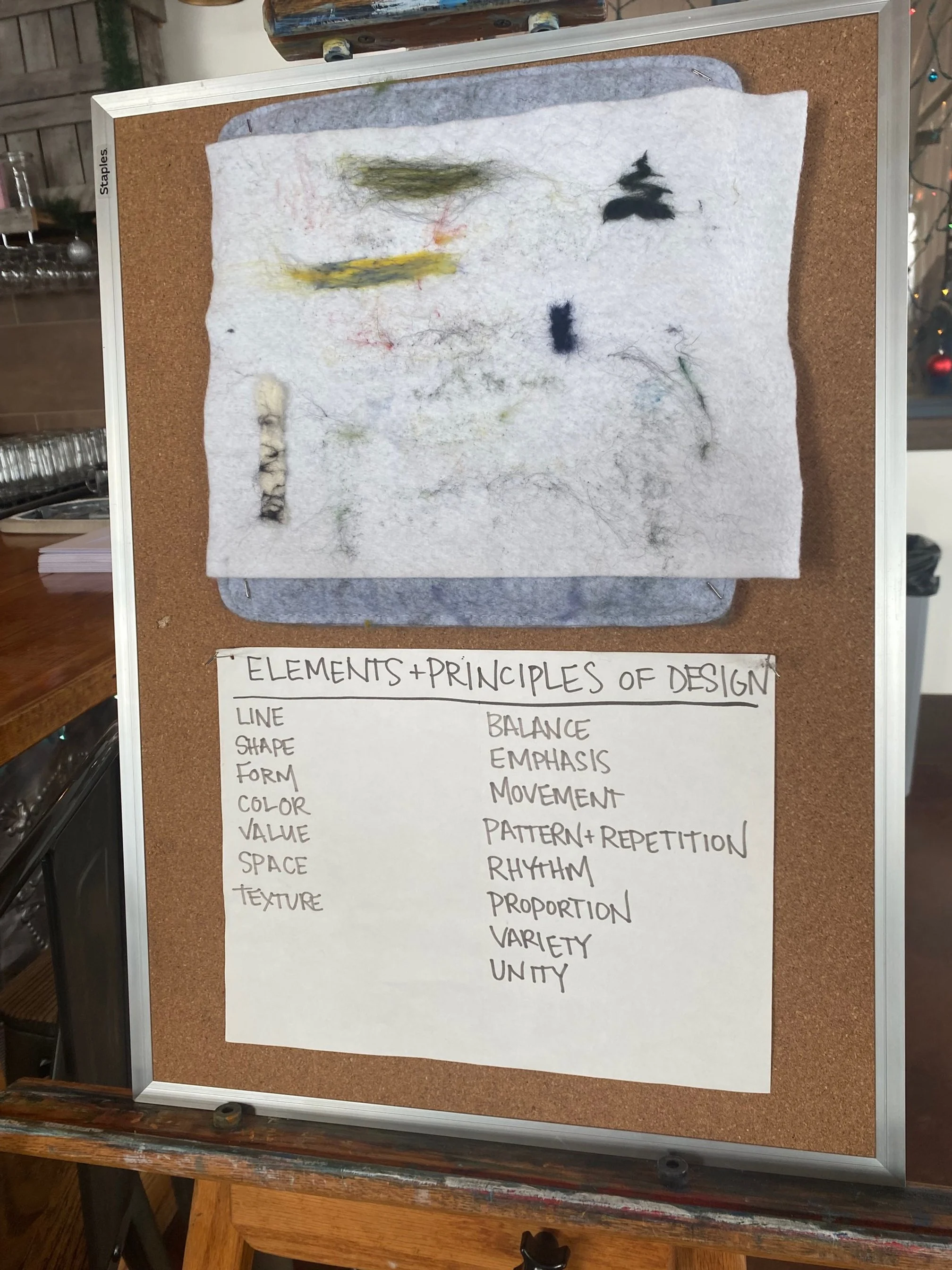 bulletin board of instructions for needle felting