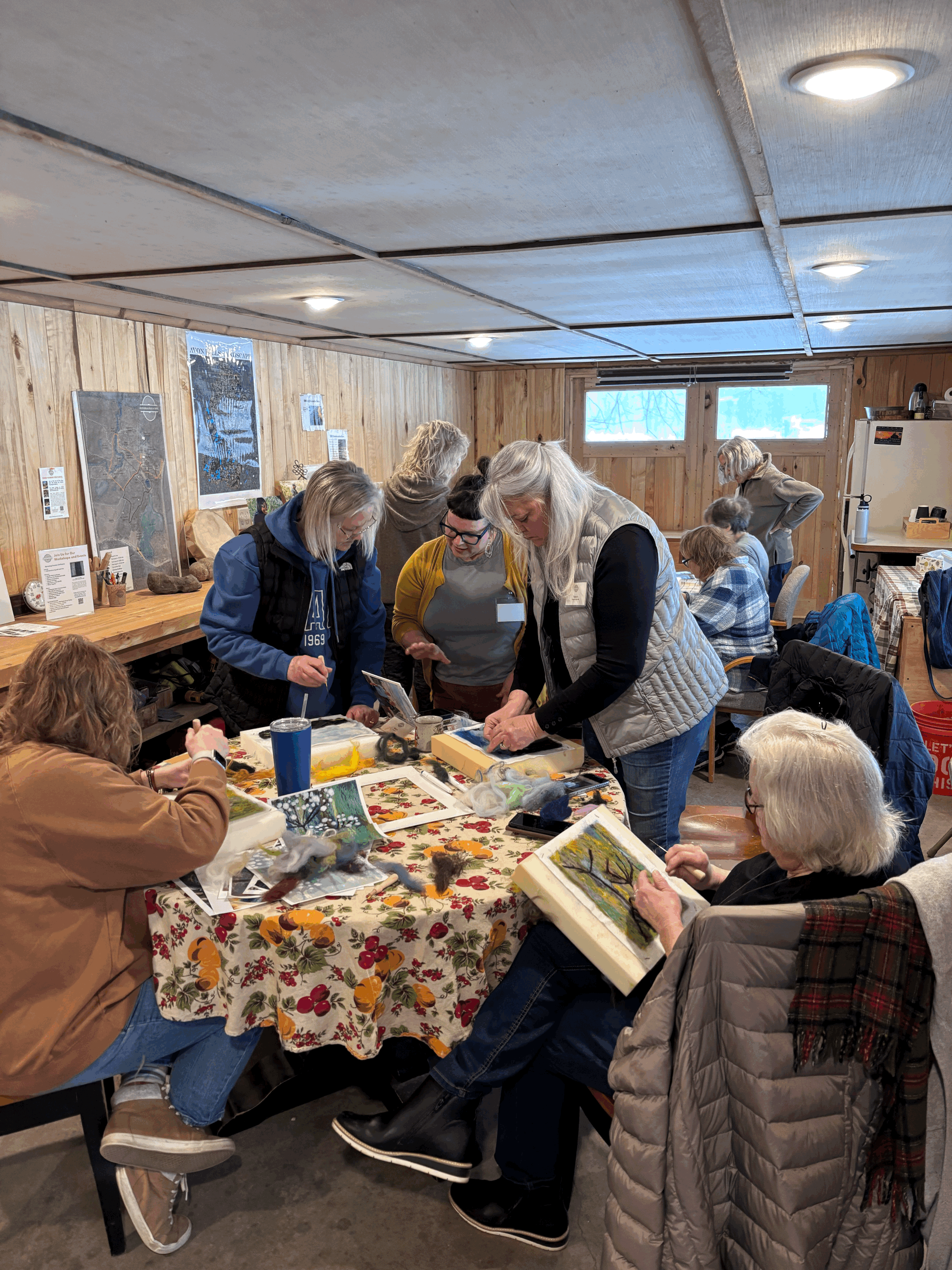 group of students learning how to do needle felting artworks