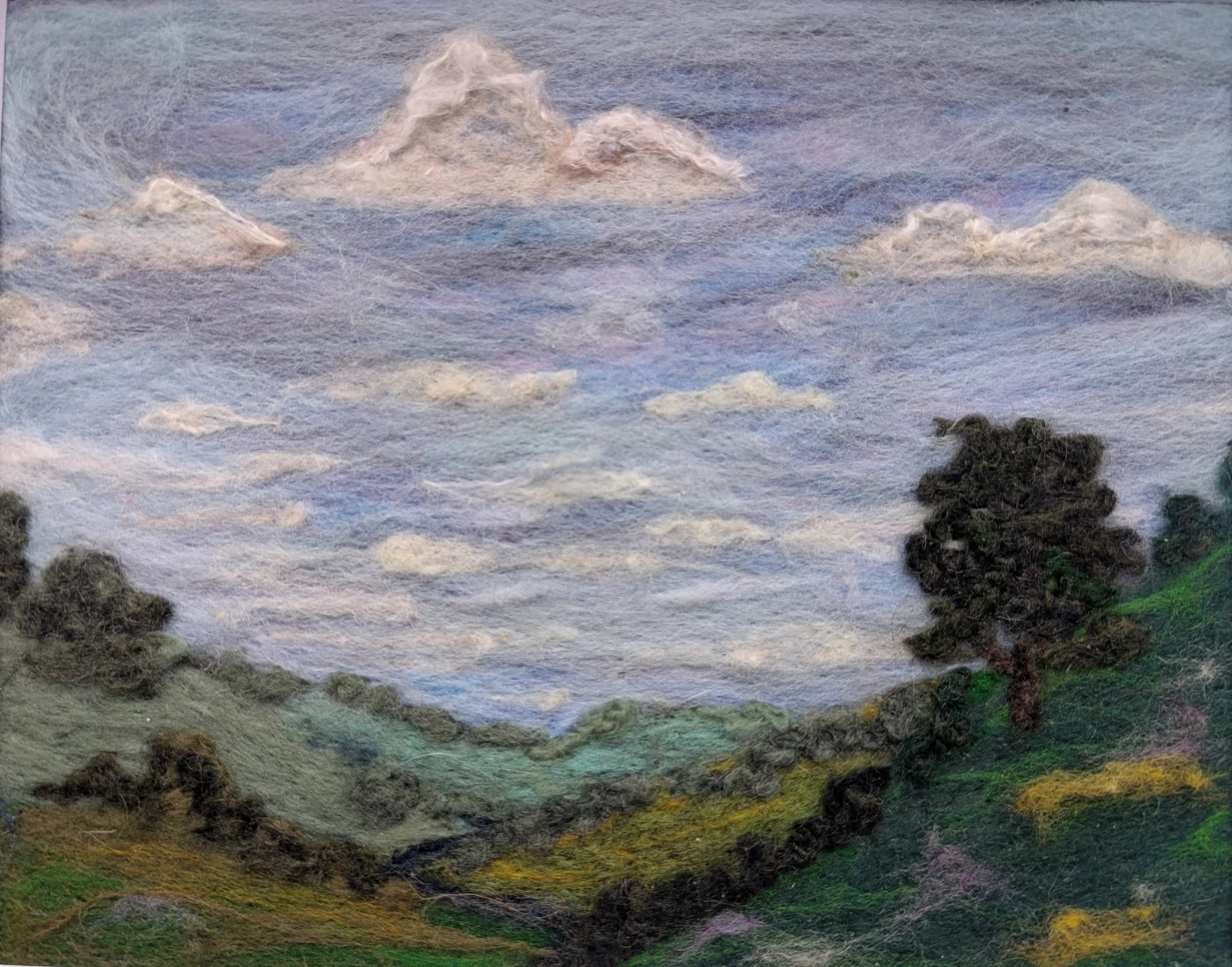 needle felted landscape artwork of sky and grass