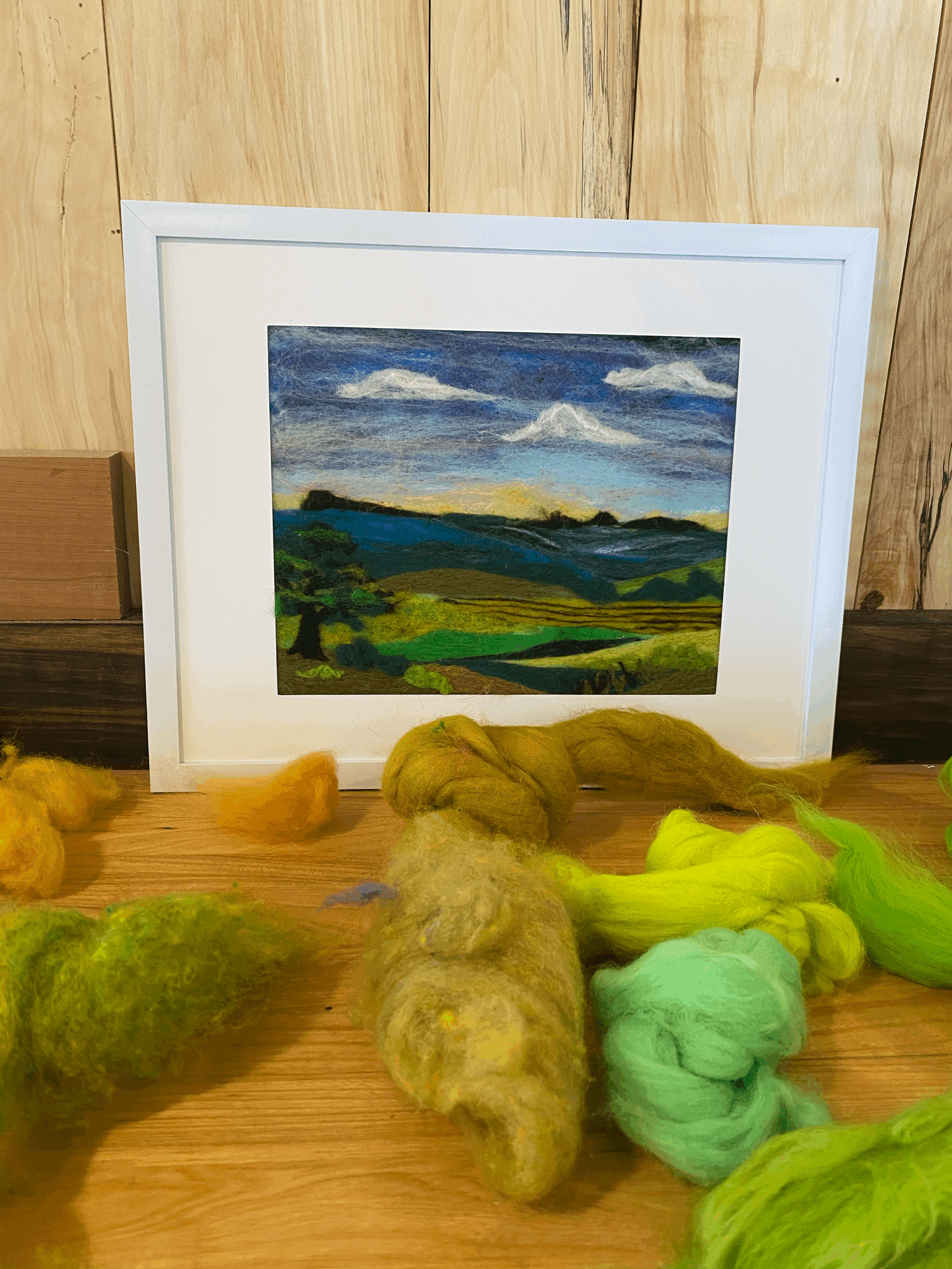 a framed needle felted landscape artwork