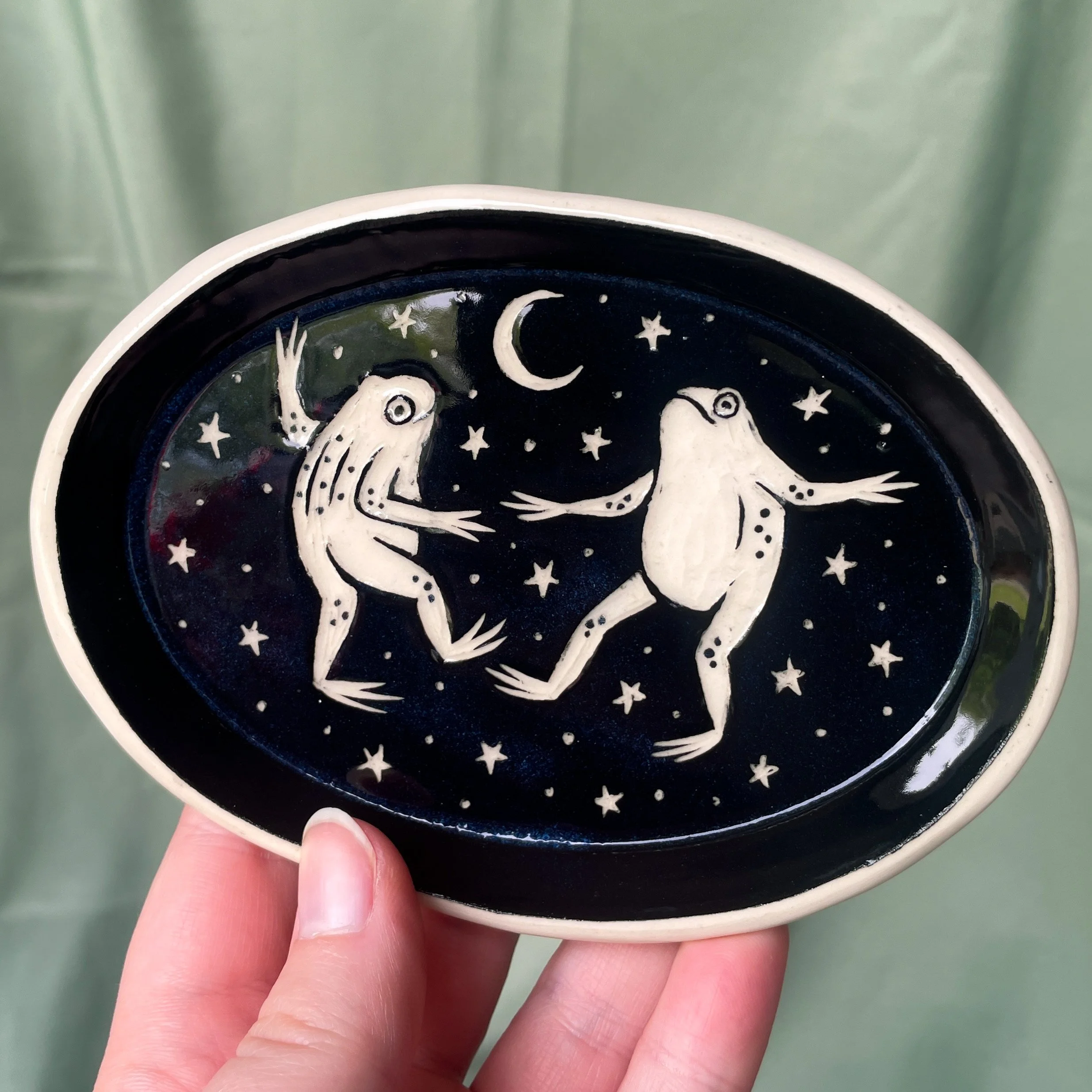 oval trinket dish dancing frogs held.JPEG