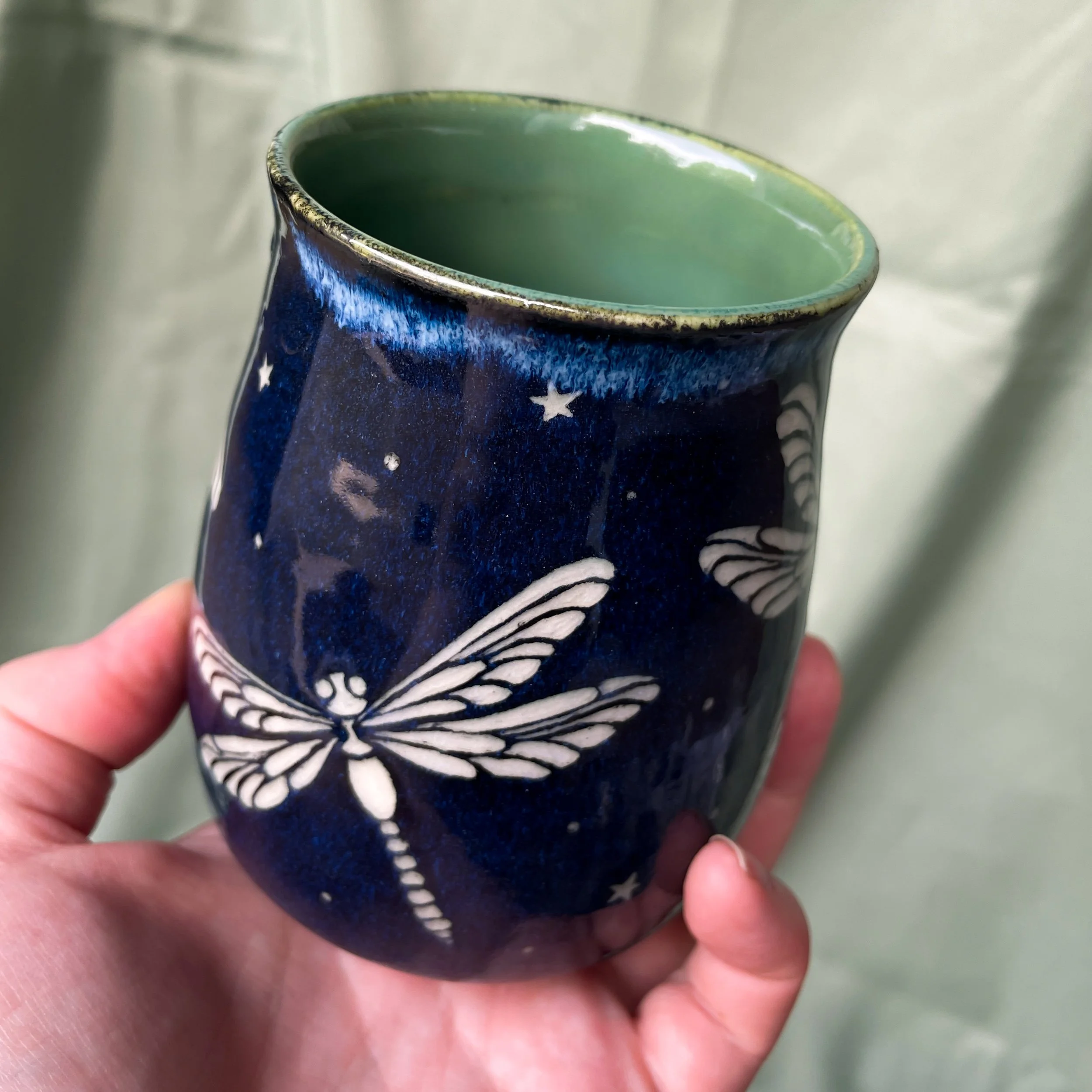 dragonfly mug a held up 1.JPEG