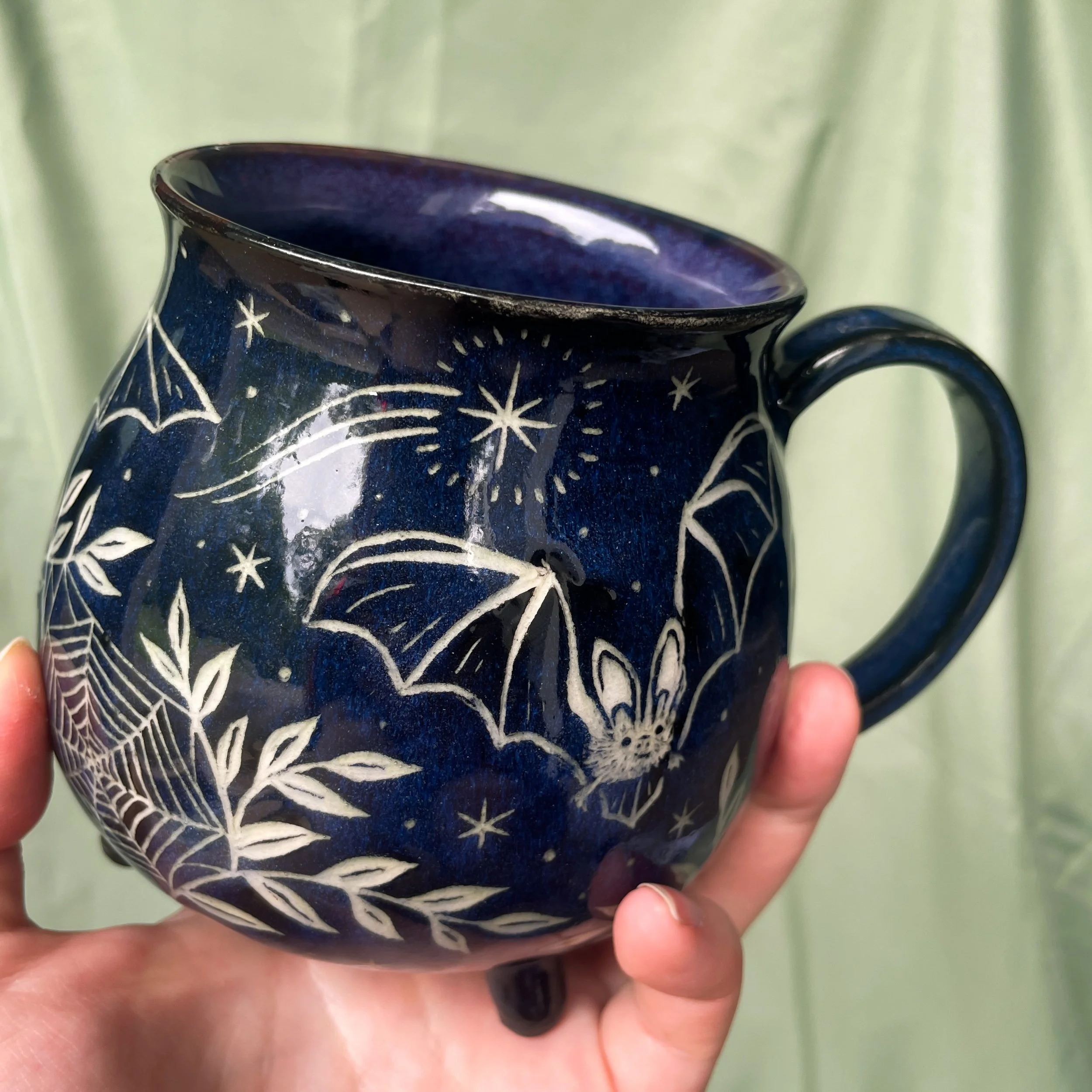 bat cauldron mug b held up.JPEG