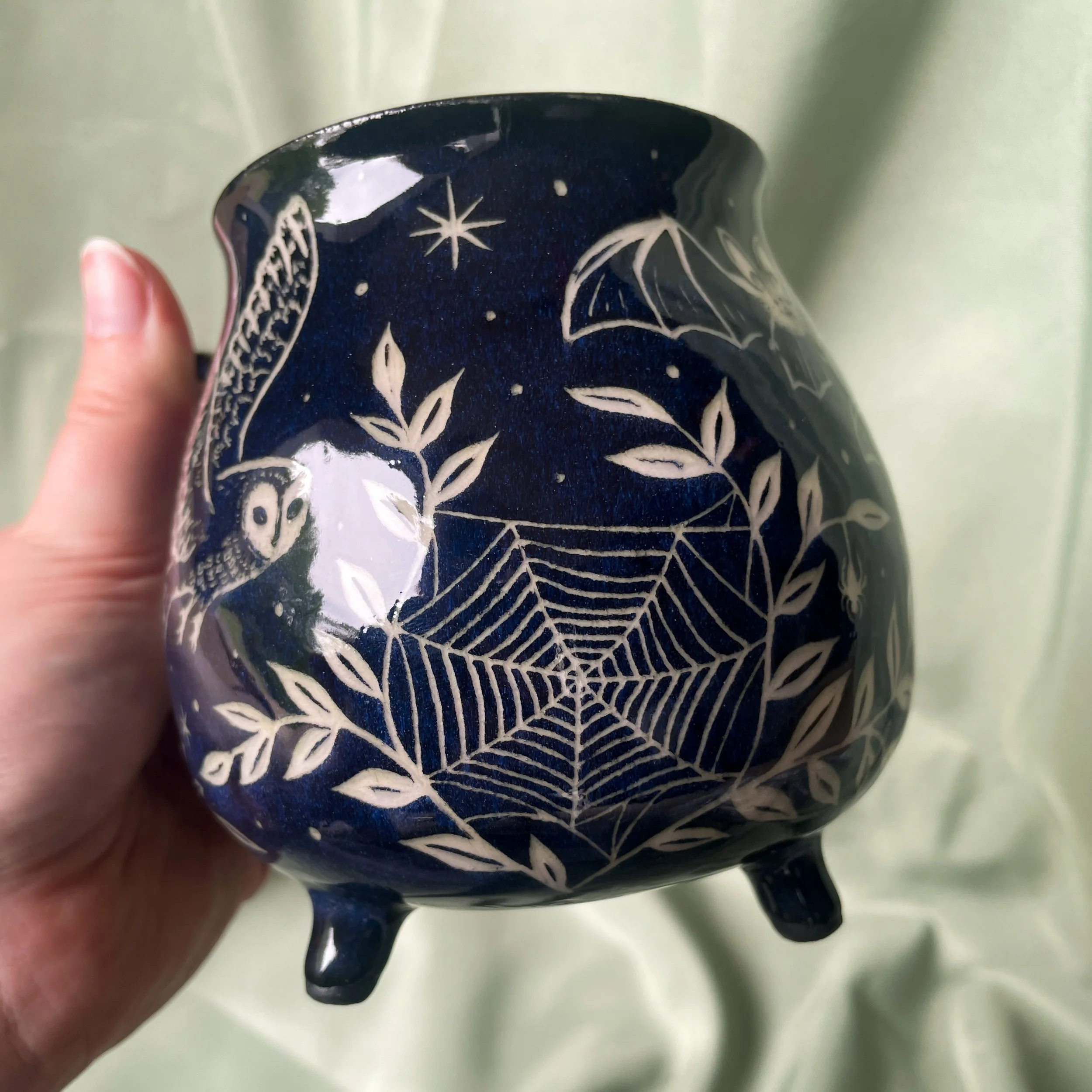 nocturnal creatures cauldron mug held up 4.JPEG