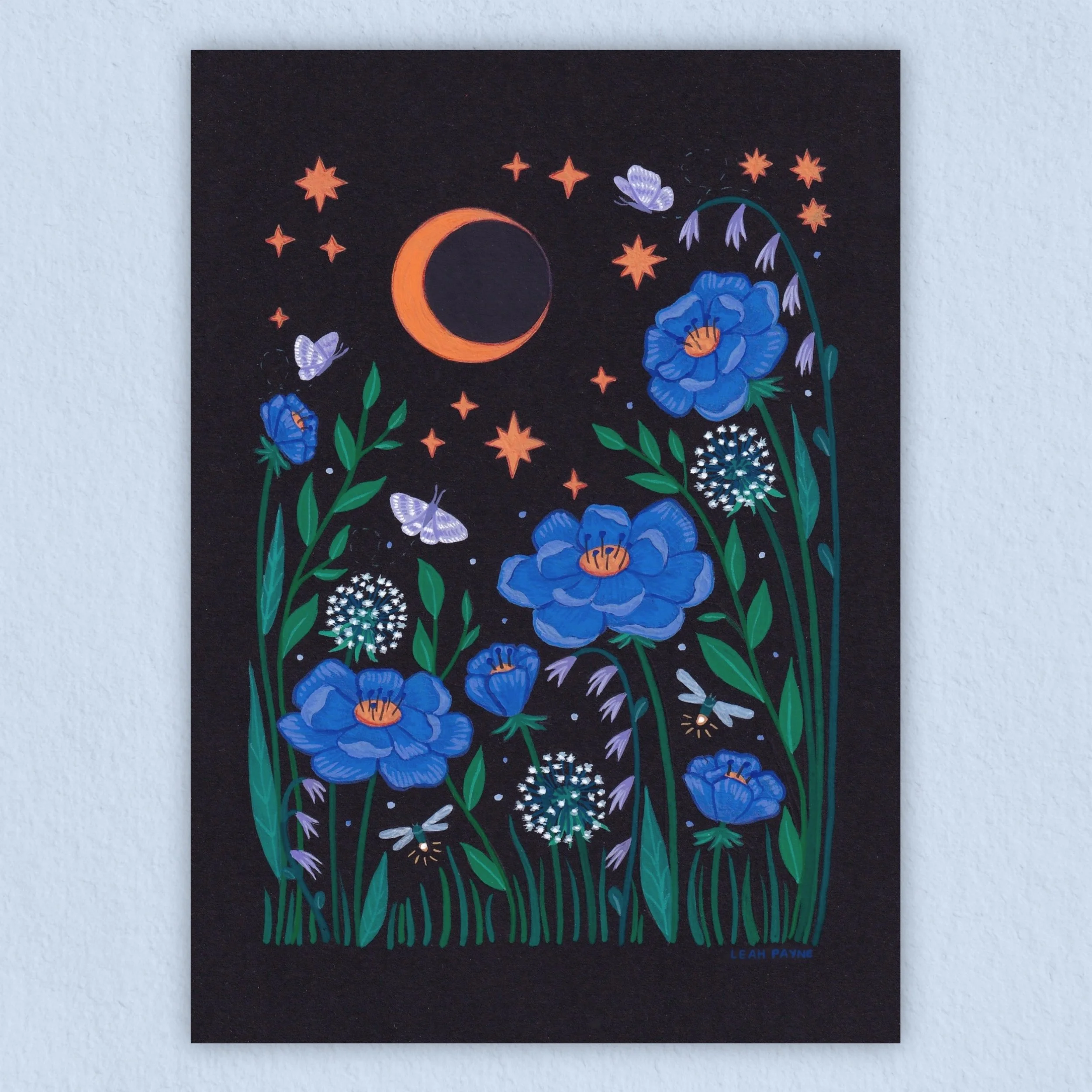 a gouache print of a yellow crescent moon above blue flowers