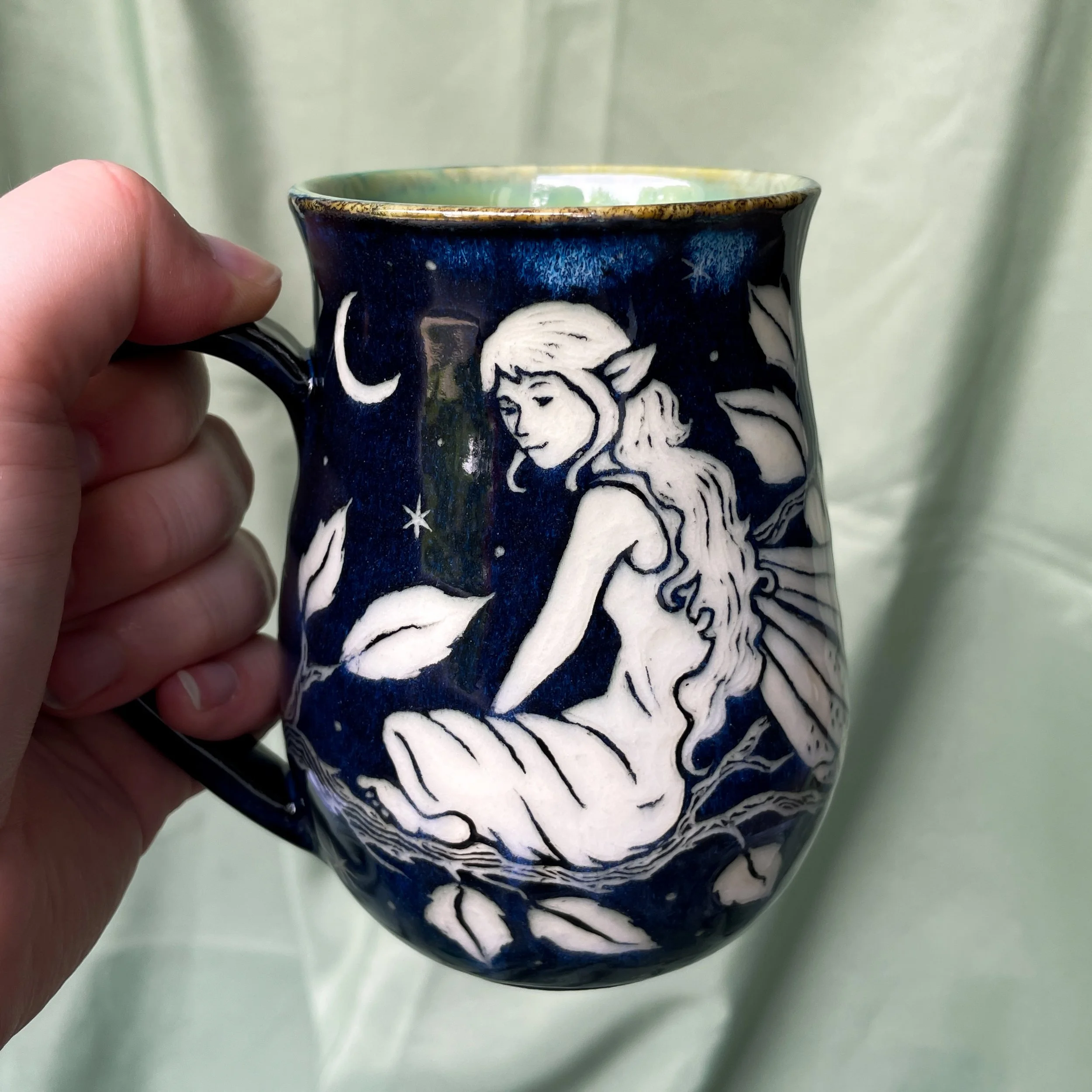 fairy mug held up 1.JPEG