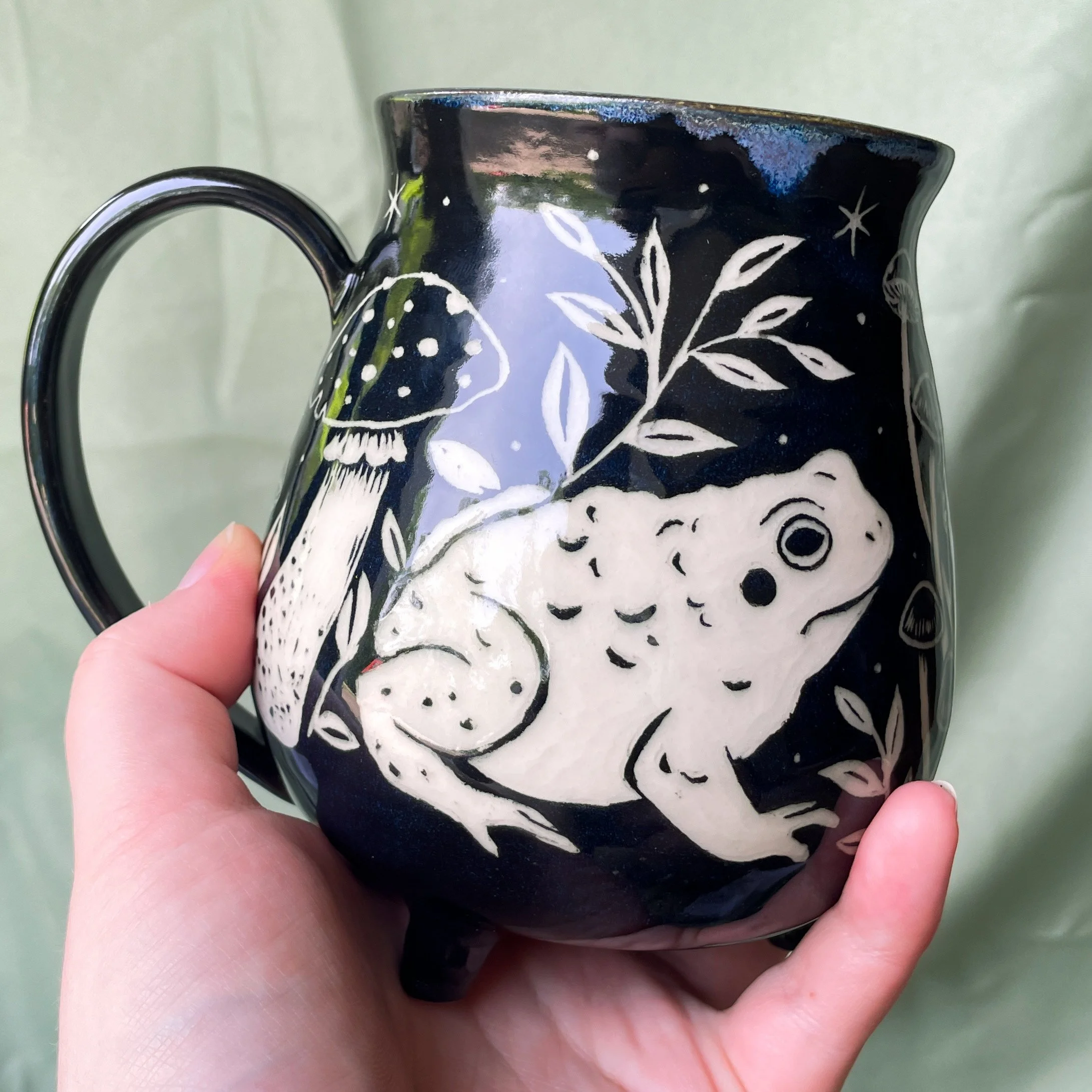 toad mug a being held up.JPEG