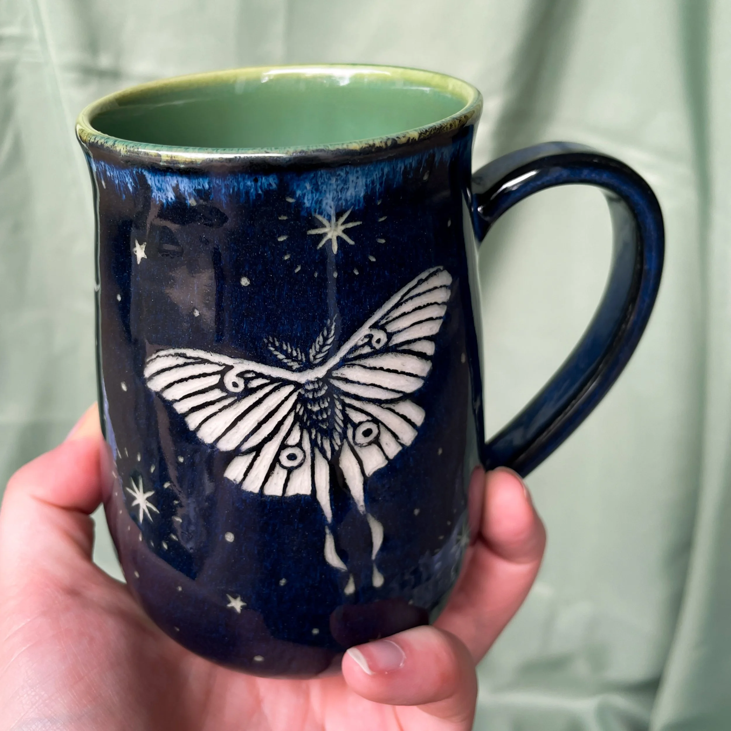moth mug b held up 2.JPEG