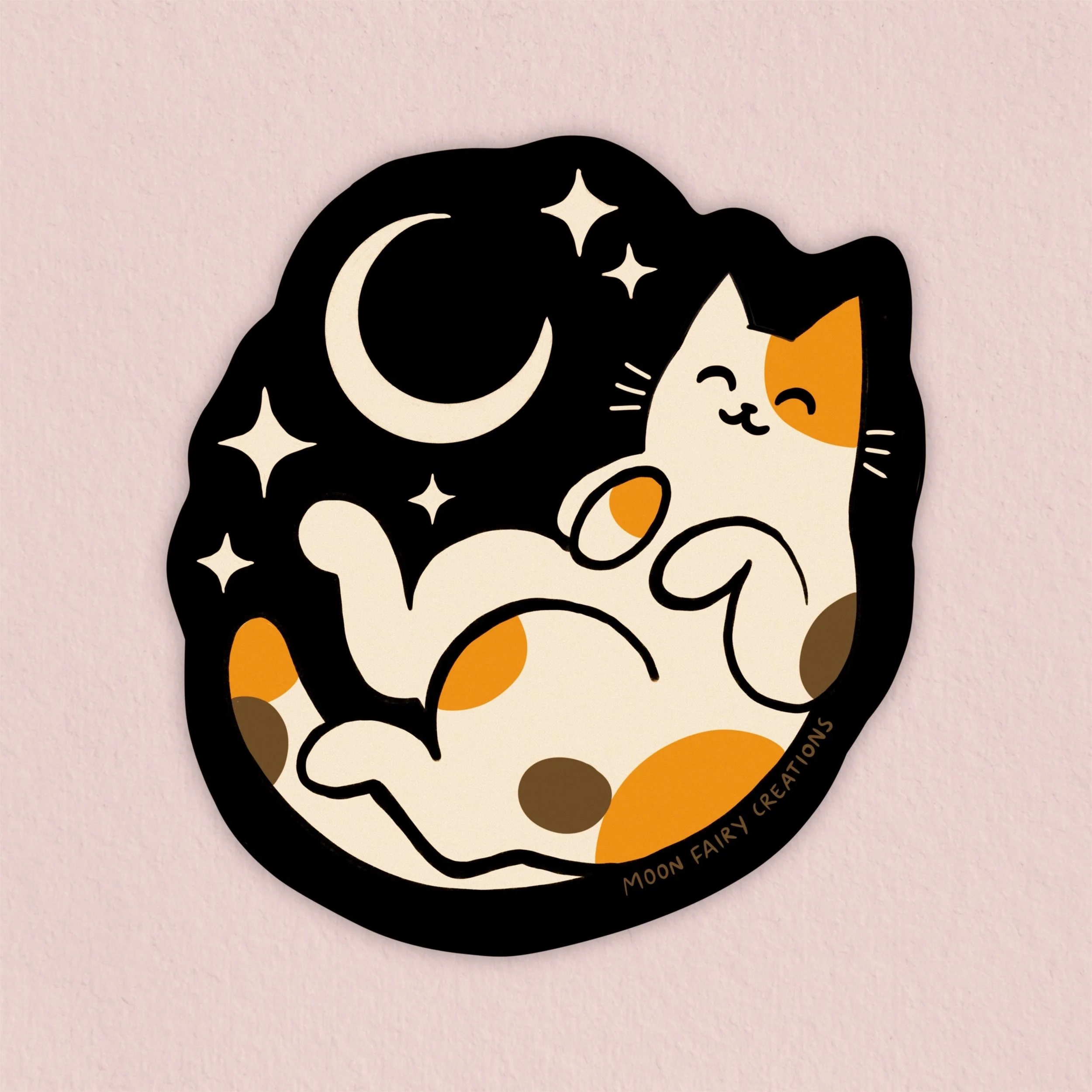 a sticker of a calico cat laying under the moon