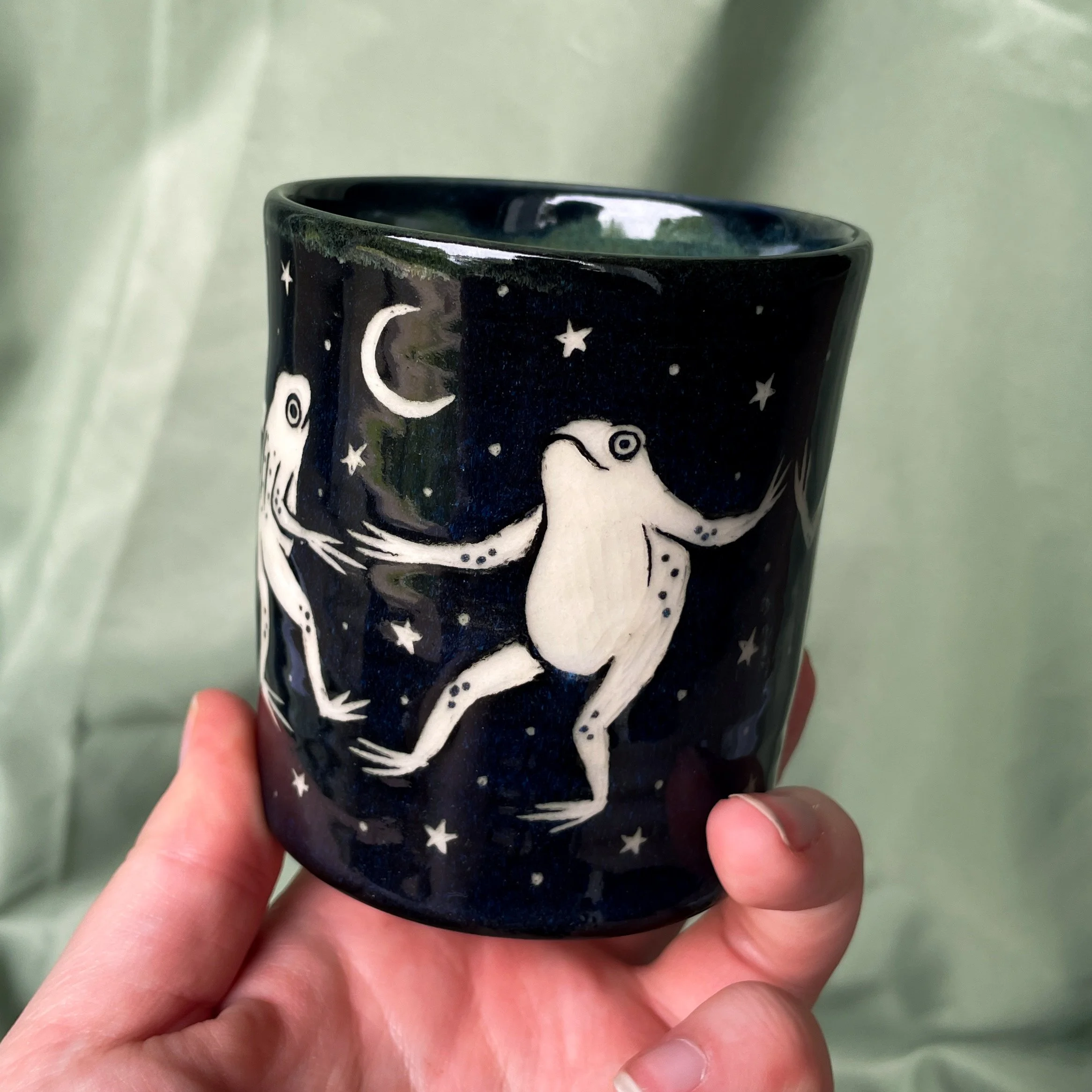cup dancing frogs a held up.JPEG
