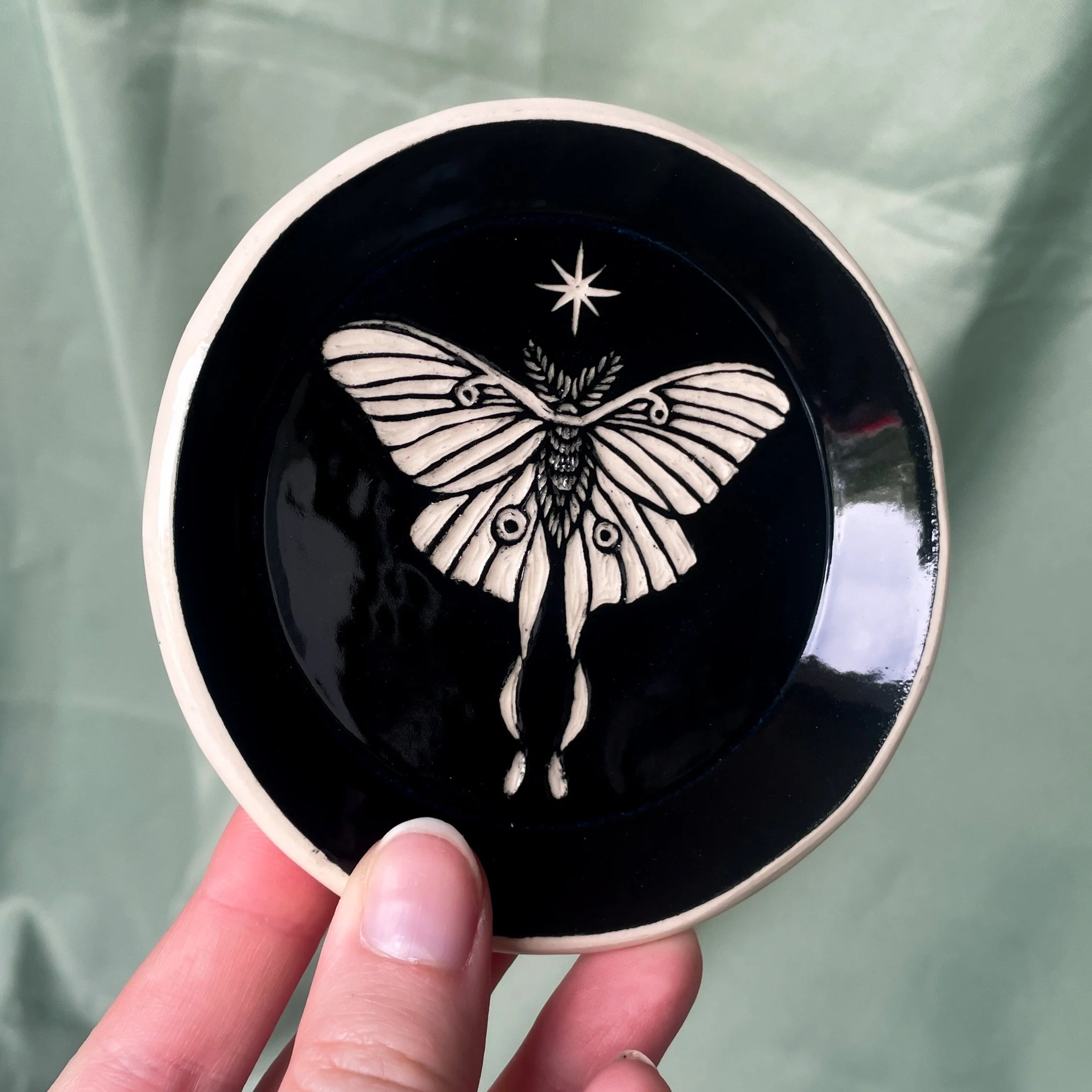 small trinket dish luna moth held.JPEG