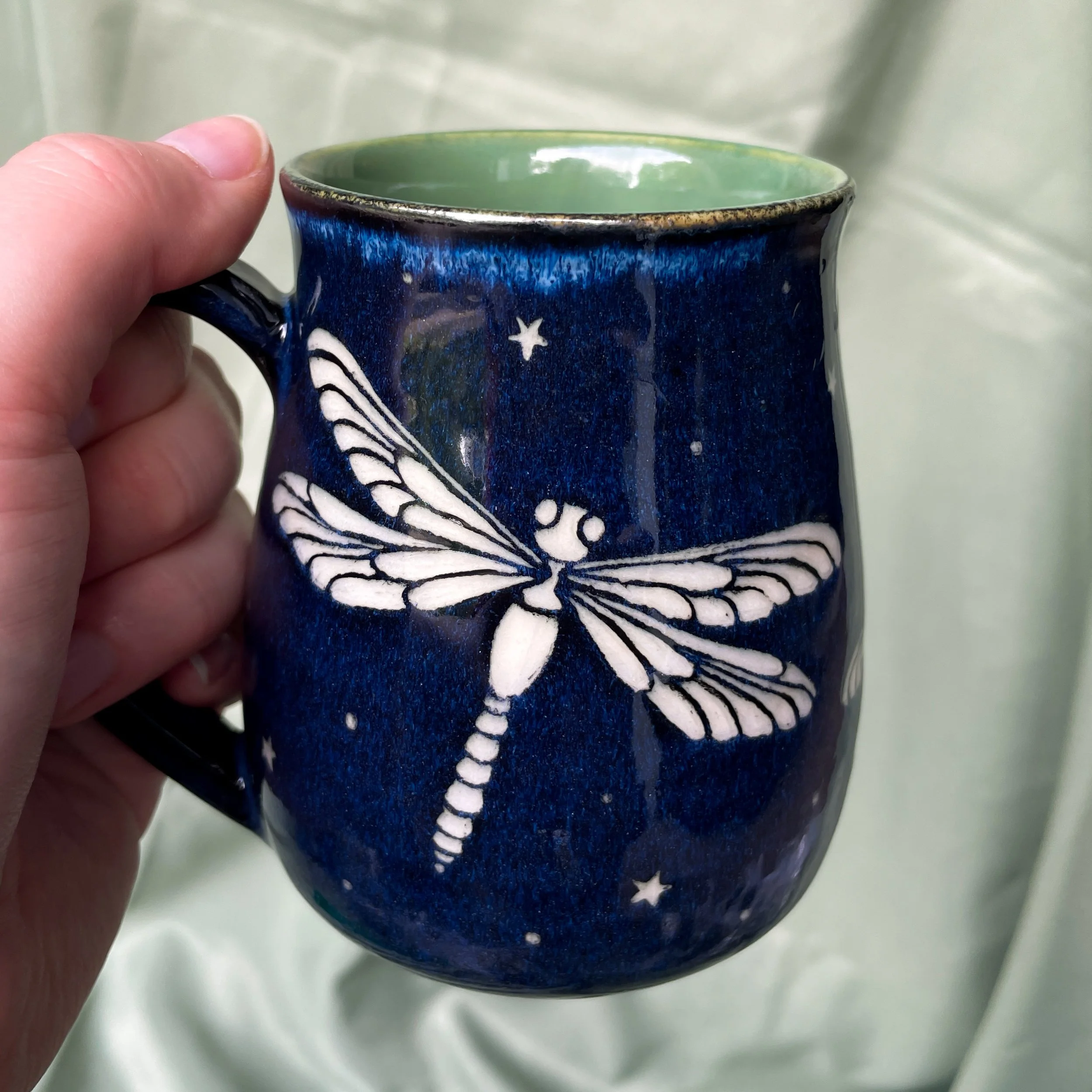 dragonfly mug a held up 2.JPEG