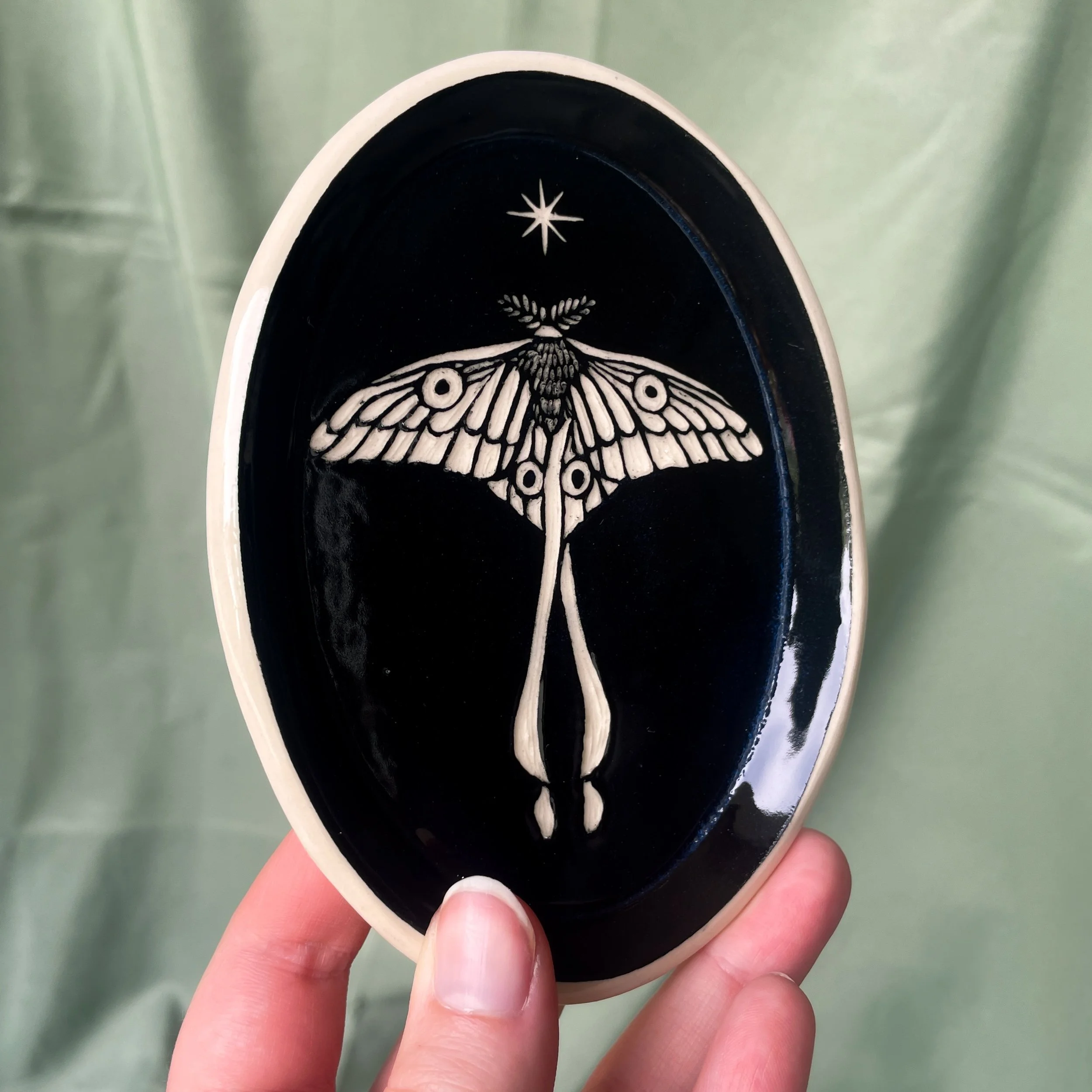 oval trinket dish moth held.JPEG
