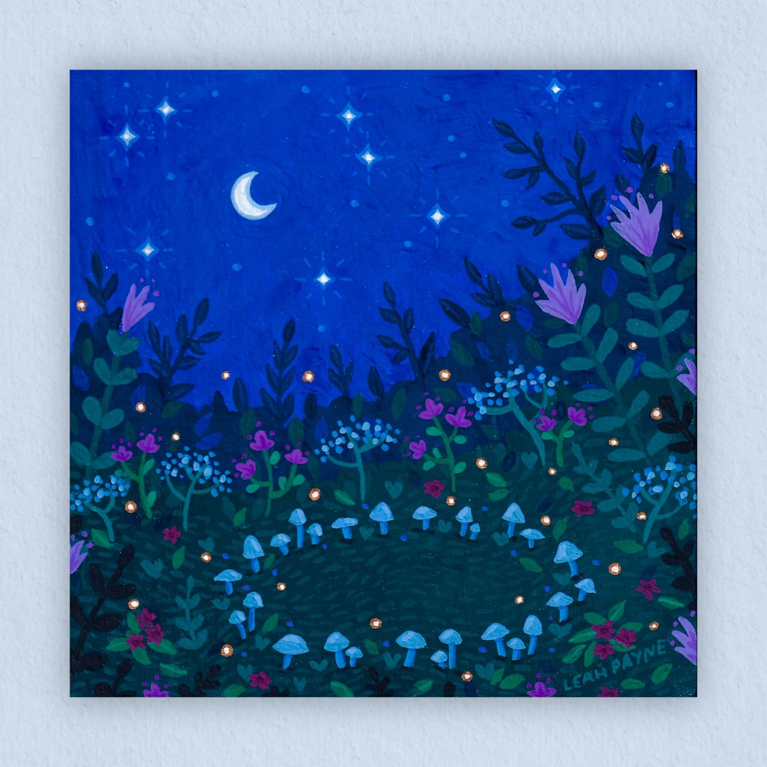 a gouache print of a ring of mushrooms in a flower field under a midnight blue night sky