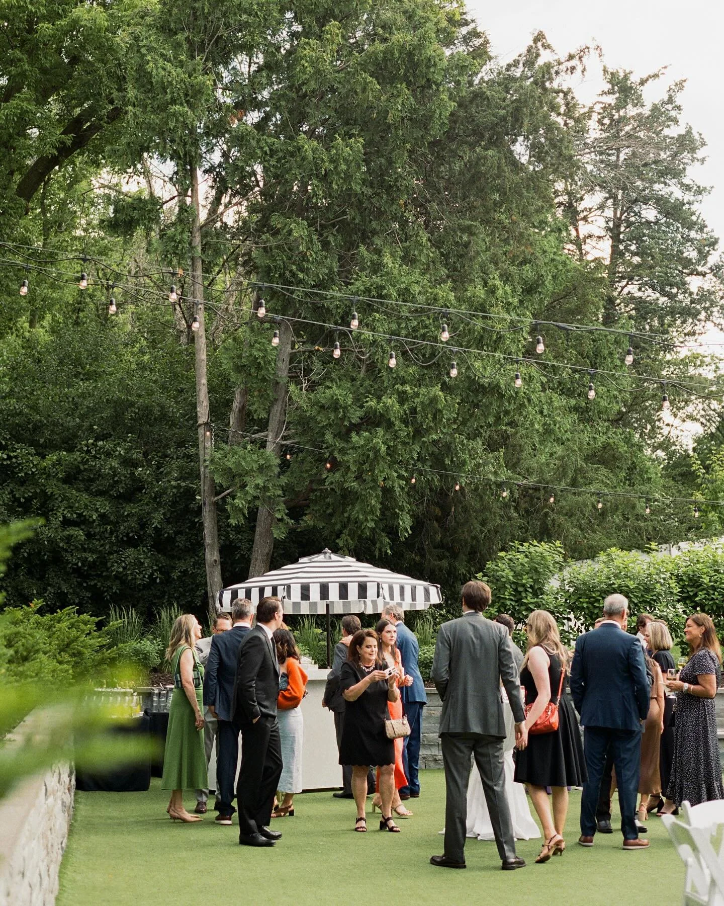 Golden hour, garden greens, and a festive summer reception 🥂 Counting down the days until this year&rsquo;s celebrations!

Captured on digital and 35mm film. 

&mdash;

Couple: @aliceewillson &amp; @markcwillson 
Photography: @hael.studio 
Planner: 