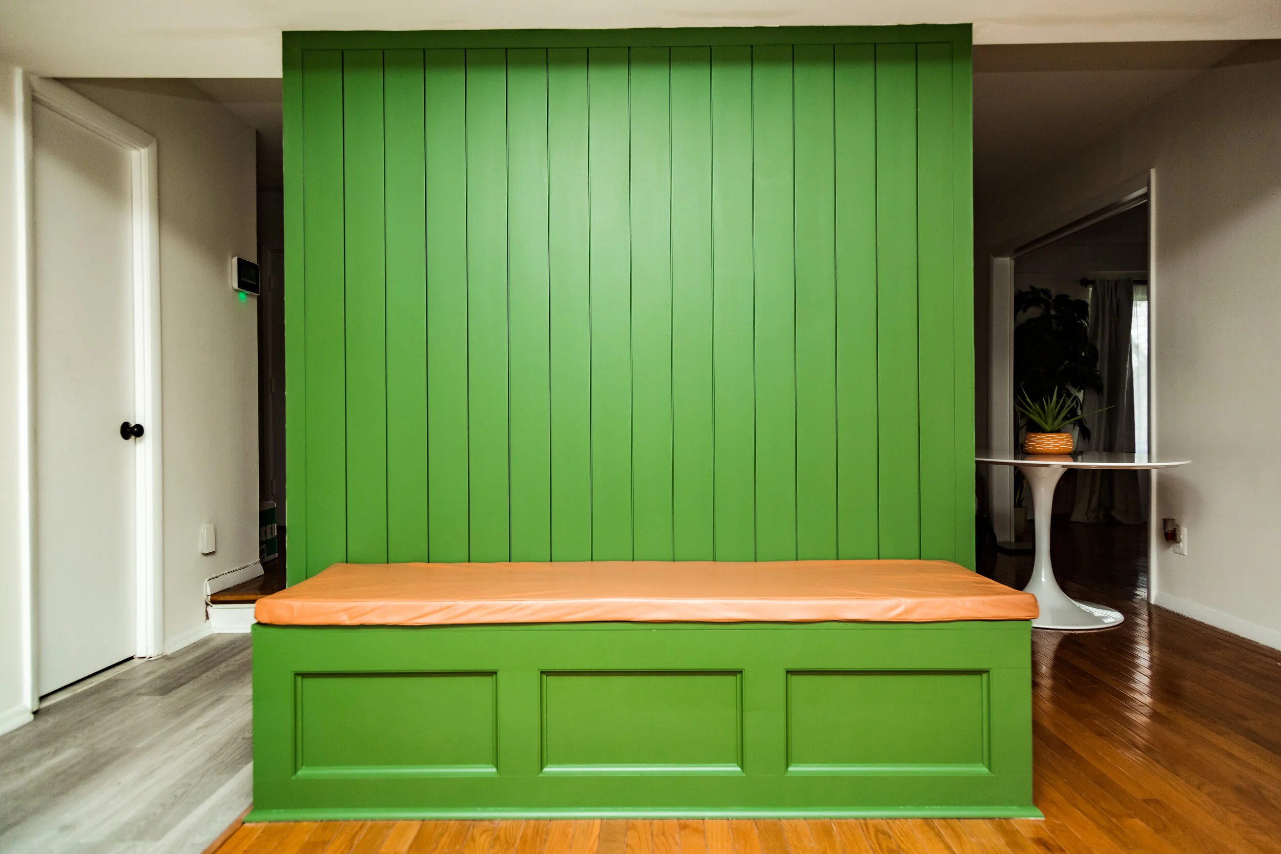 Bistro bench with shiplap wall.