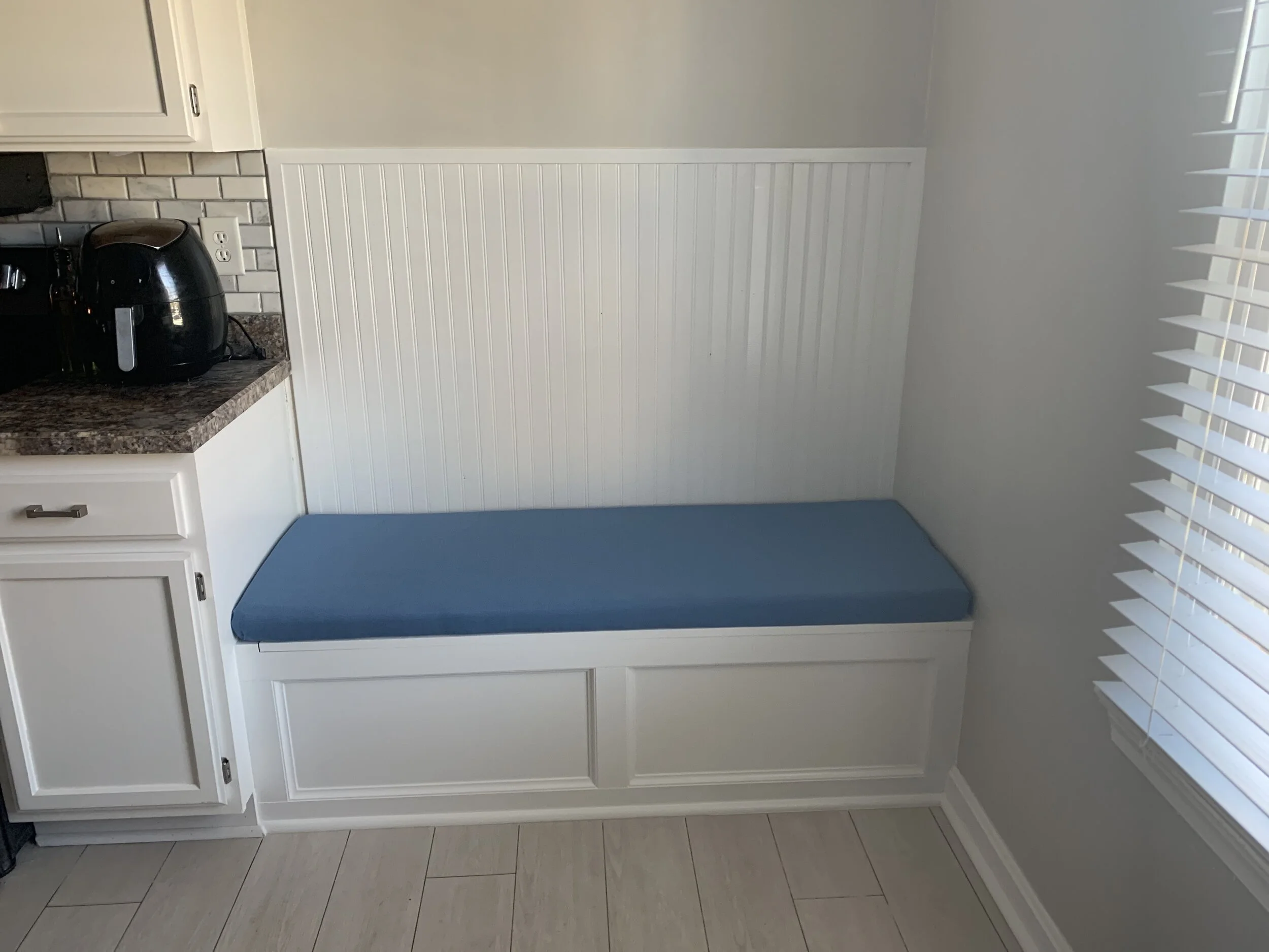 Built-in breakfast nook with custom cushion and storage.