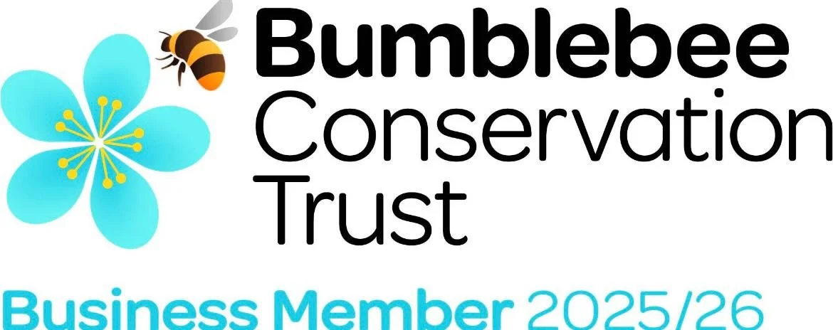 Logo for Bumblebee Conservation Trust featuring a bee flying above a blue flower with text indicating membership for 2025/26.