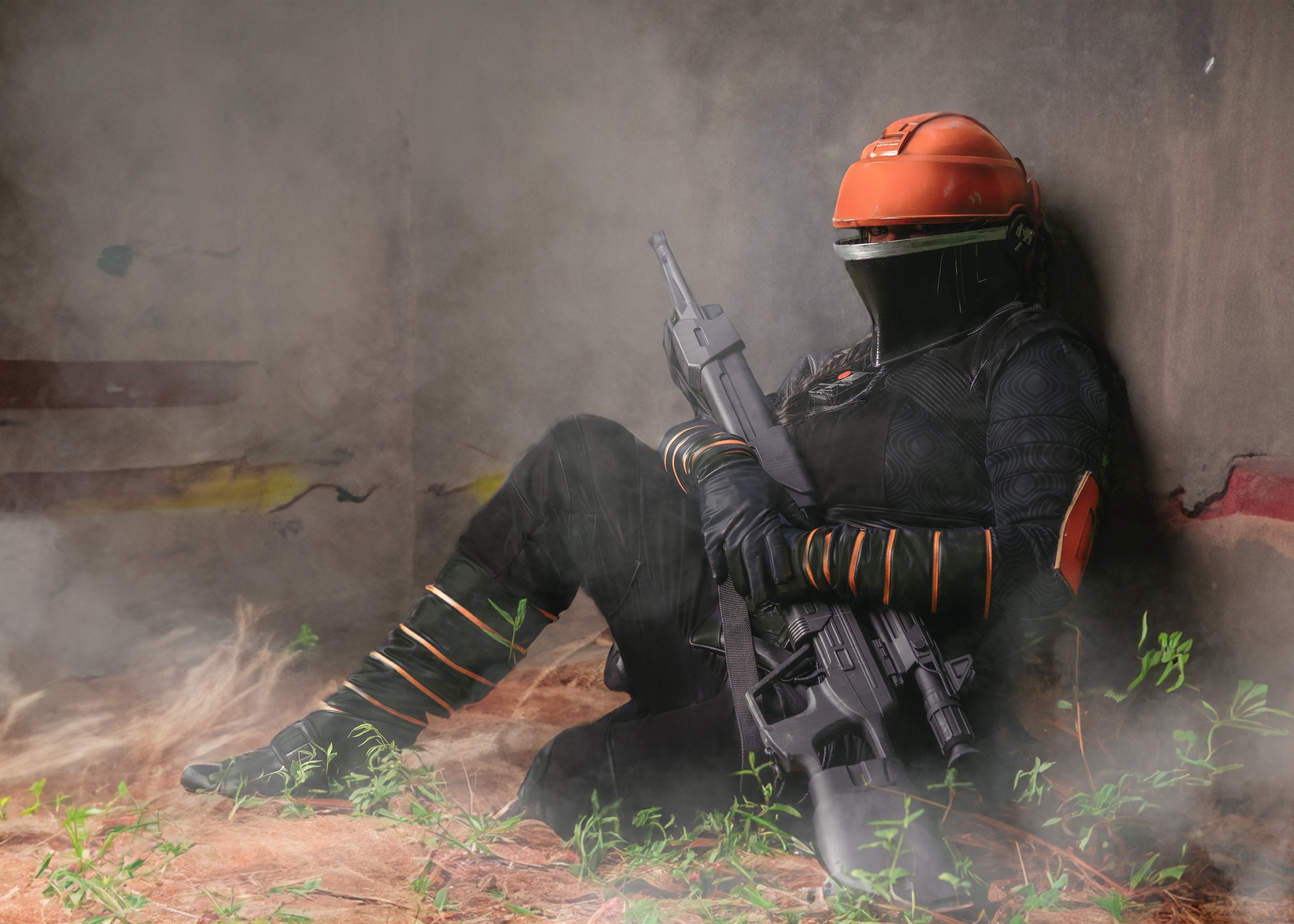 Futuristic soldier in orange helmet holding a rifle, sitting against a wall in a smoky environment. Star Wars themed
