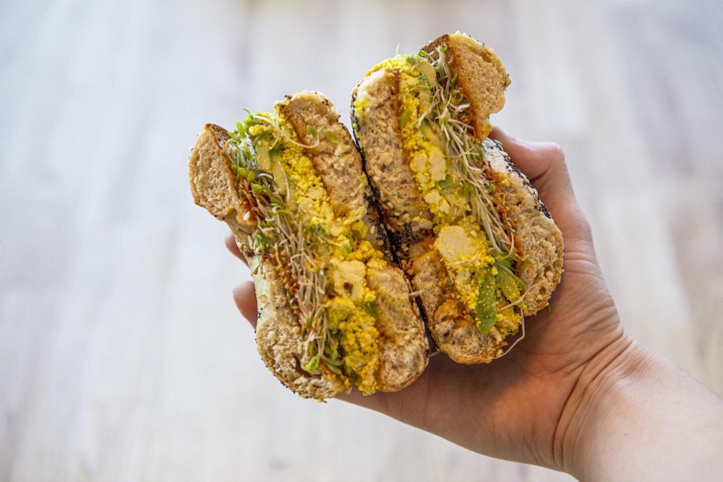 All about the Santi Bagel: Tofu egg, peanut butter, avocado, sriracha, sprouts on a toasted everything bagel. Hits the spot every time.