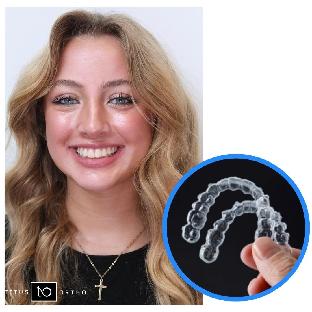 Smiling woman holding a clear dental aligner. - How Does Invisalign Work in Westfield, IN?