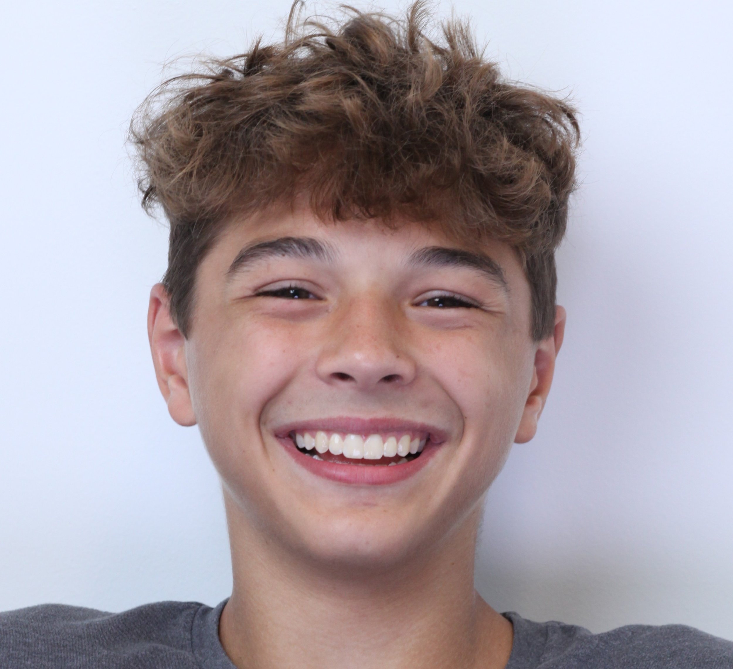 Smiling teenage boy office portrait – Can Invisalign Fix Overbite in Westfield, IN.