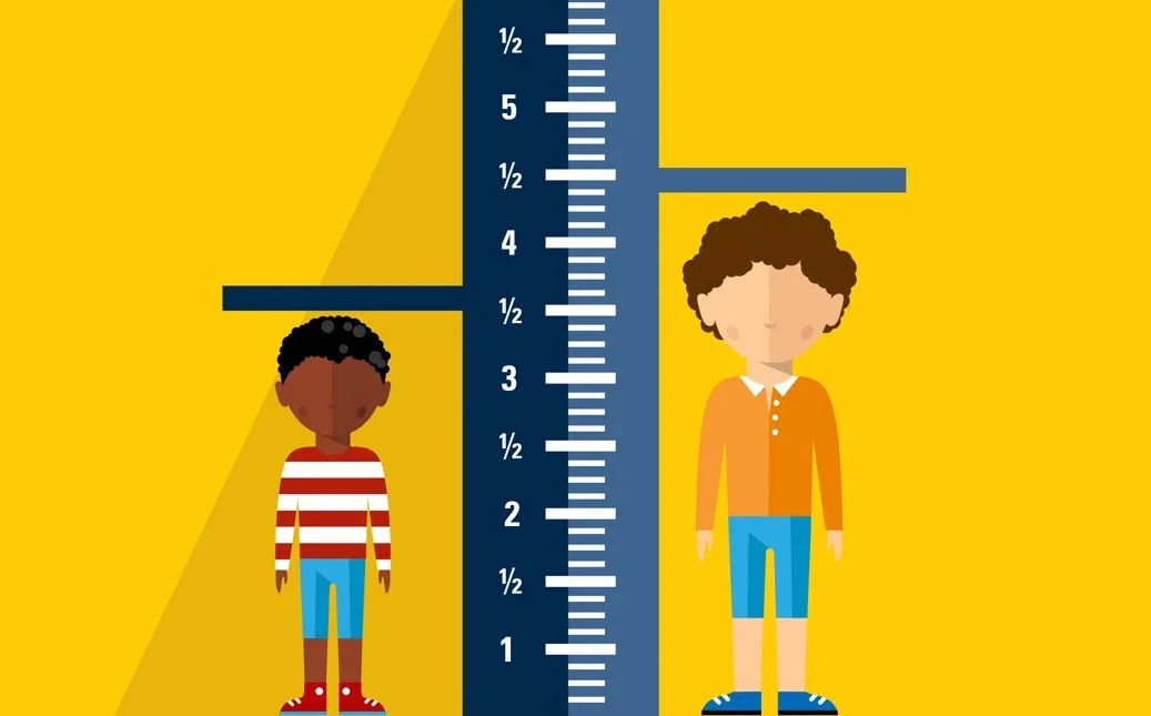 Cartoon graphic showing child’s height growth with measuring scale - Overbite vs. Underbite in Westfield, IN