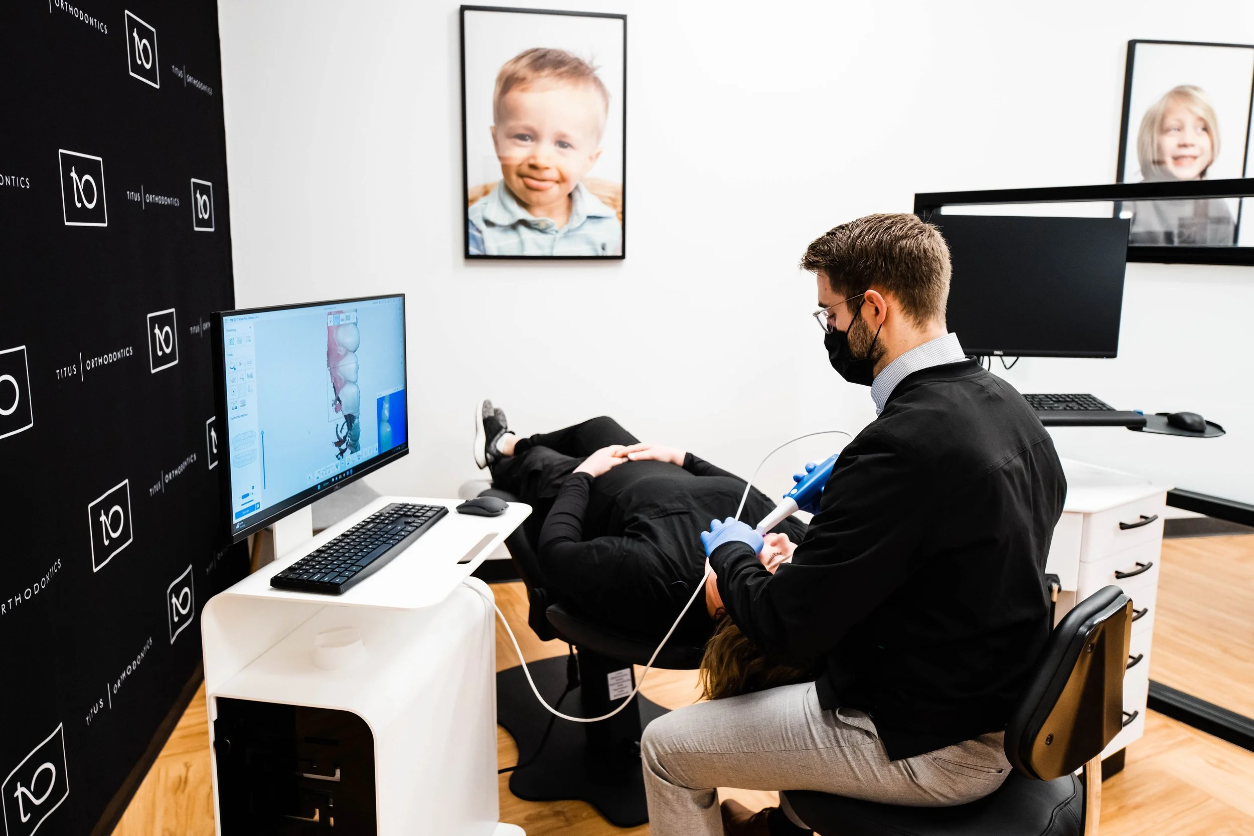 Orthodontist reviewing treatment plans with a patient – Does Insurance Cover Invisalign in Westfield, IN?