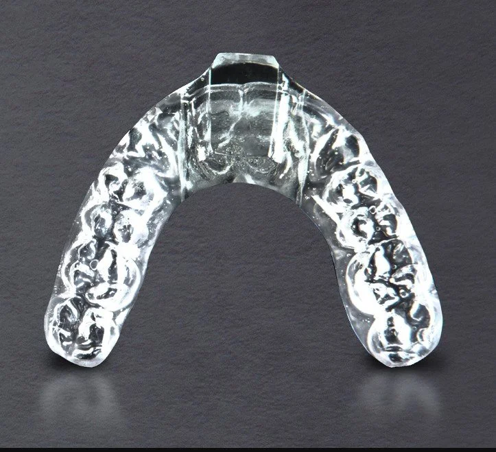 Transparent dental aligner used for orthodontic teeth straightening - TMJ Treatment in Westfield, IN