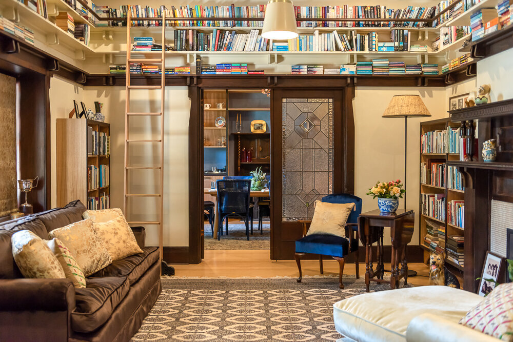 An incredible transformation. The former lounge turned book room with mezzanine shelving. Image: VSTYLE