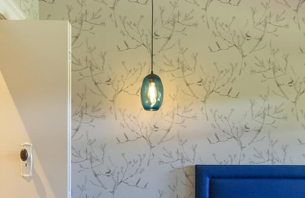 Hand blown glass pendants by Mark Douglass, Melbourne and up-cycled door handles to walk in robe doors. Image: VSTYLE