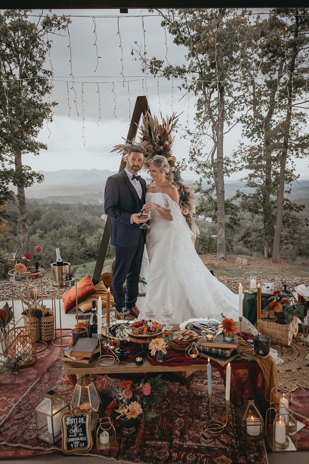 Opulent Asheville luxury picnic setup with premium florals, layered tablescape, and mountain backdrop for elopements and intimate weddings.