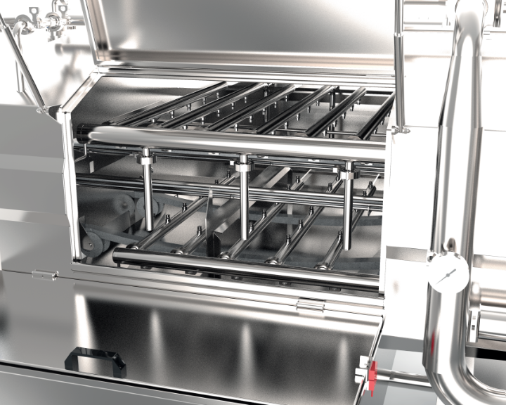 A close up of a Qualtech Tunnel Washer machine showing the internal layout.