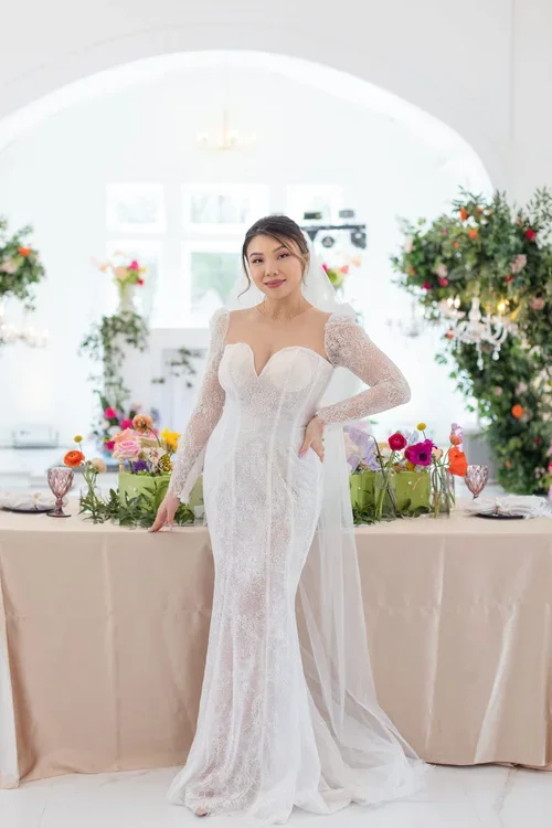 Bride in white lace gown at garden wedding — elegant white dresses guide at Estelle Bridal Houston